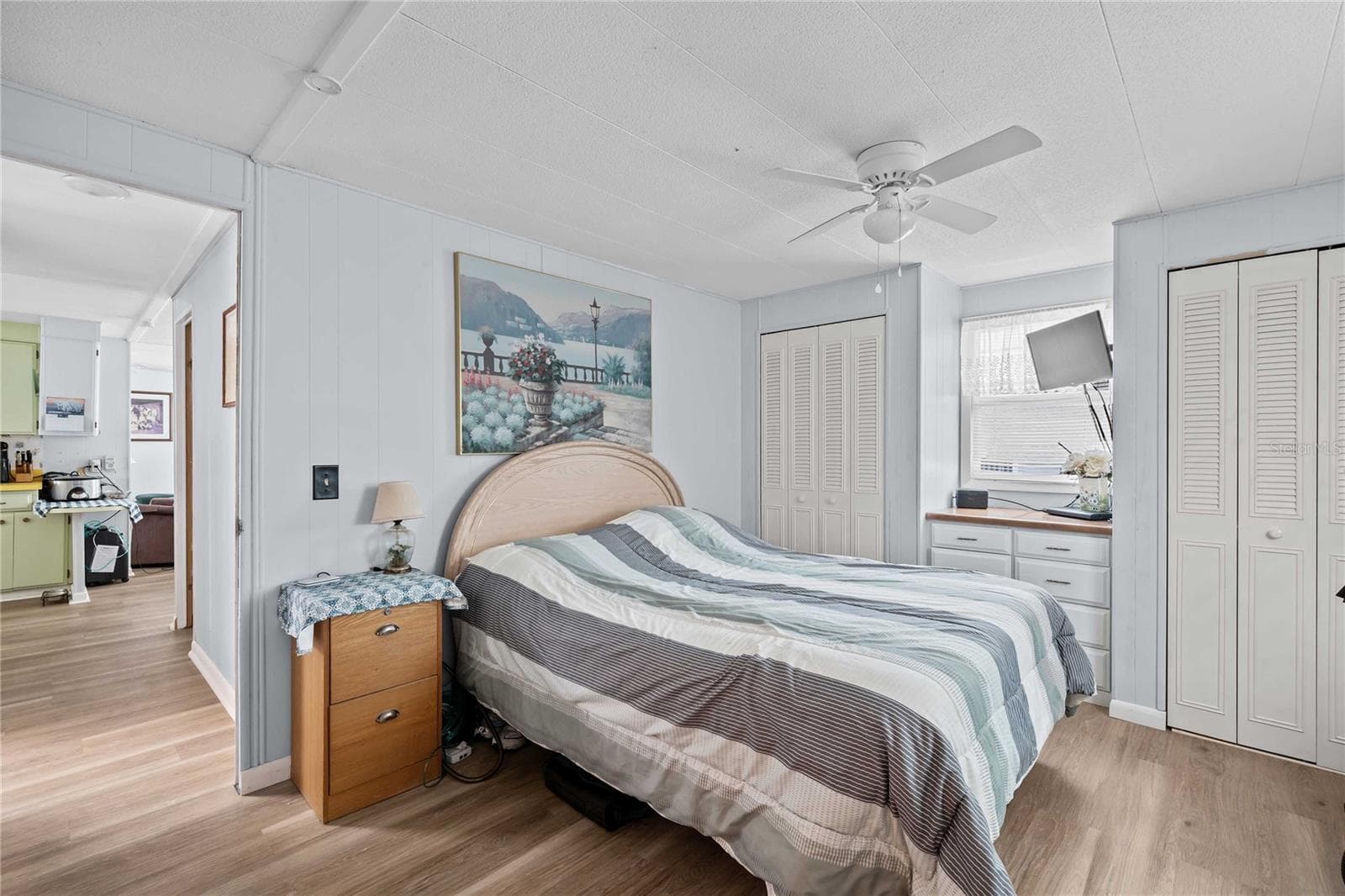 The primary bedroom accommodates a king size bed - 5301 FLINT ST, ZEPHYRHILLS