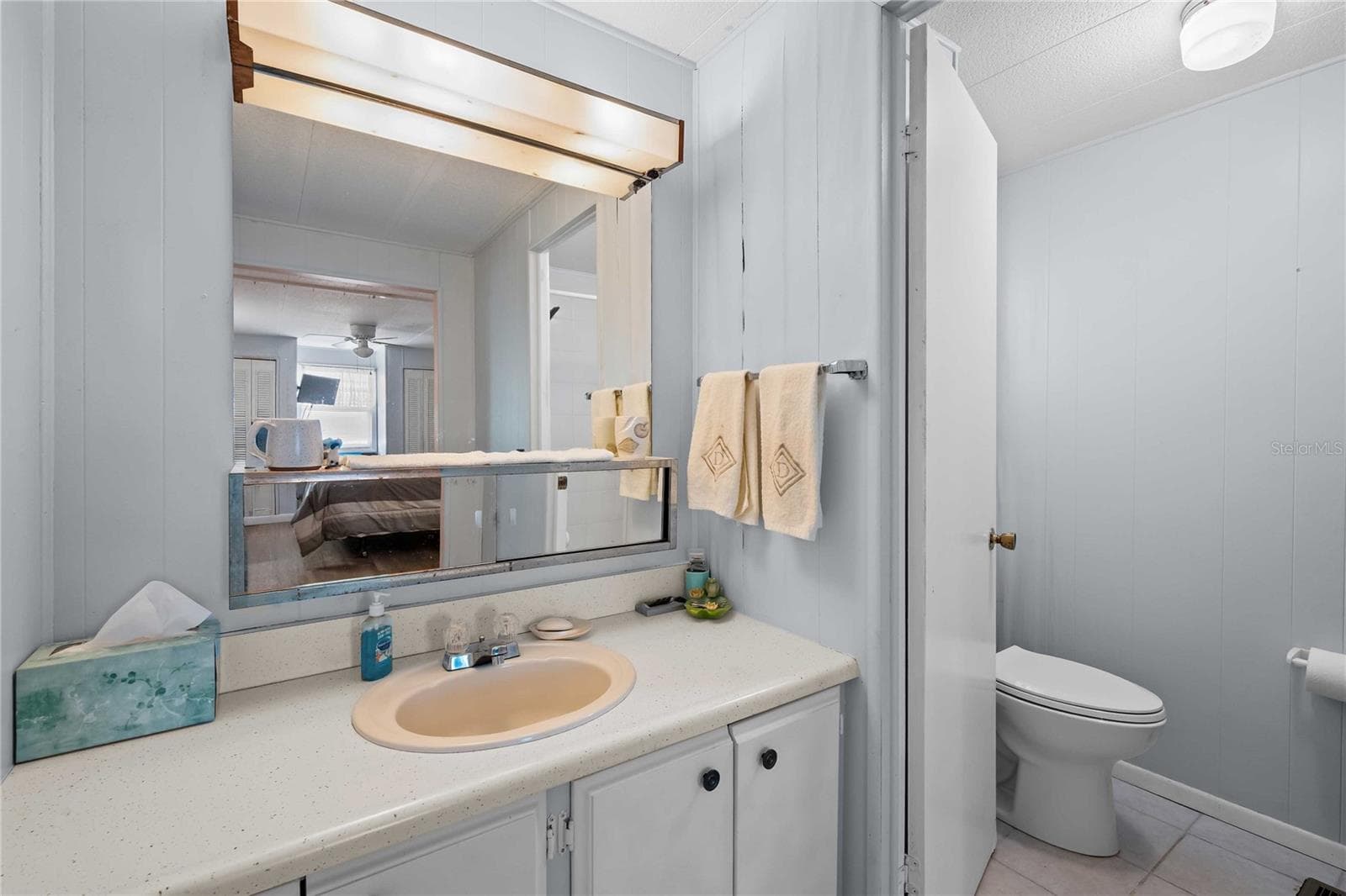 The primary bath ensuite has a updated walk in shower - 5301 FLINT ST, ZEPHYRHILLS