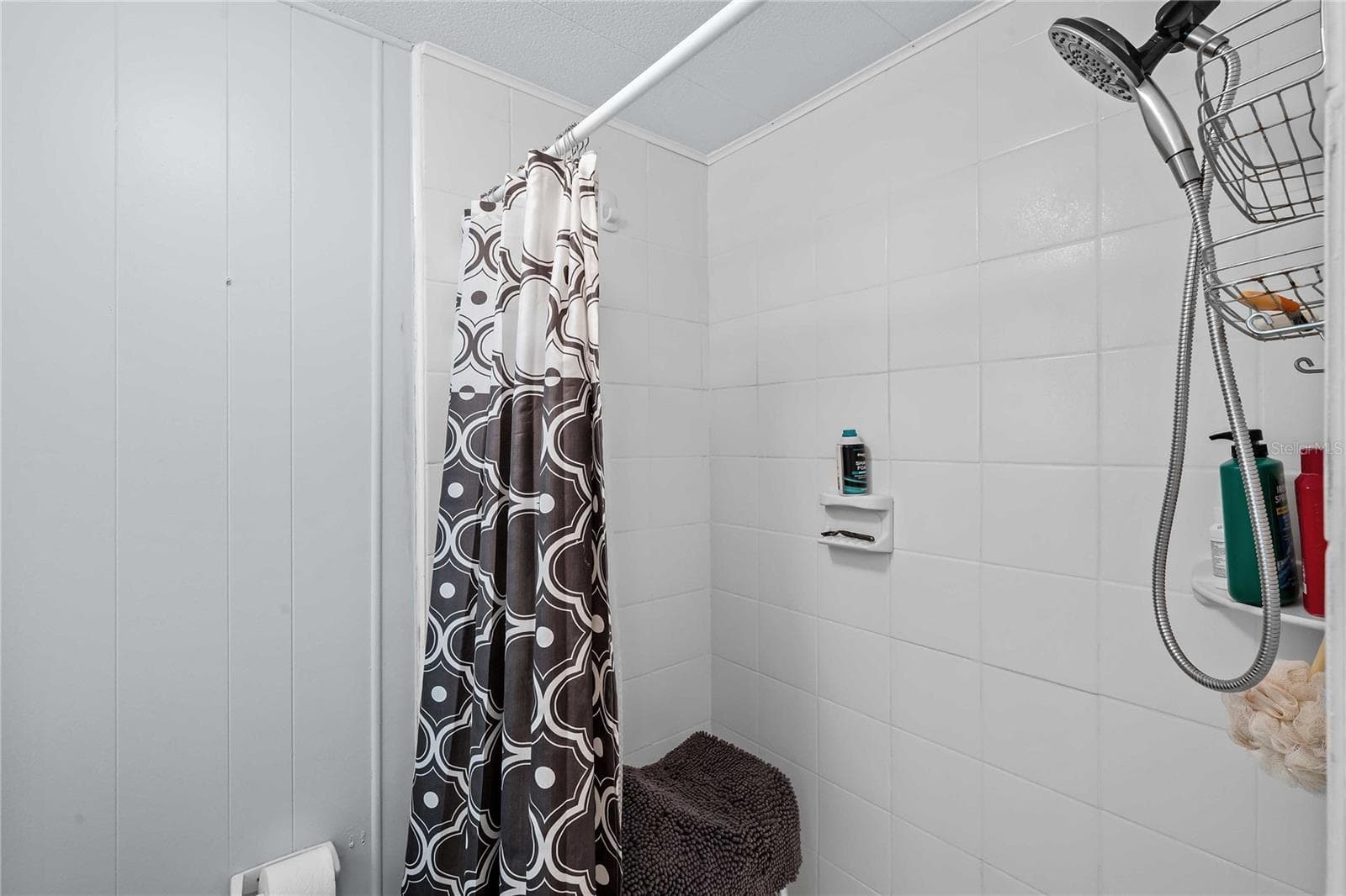 Tile floors in the primary bath shower area - 5301 FLINT ST, ZEPHYRHILLS