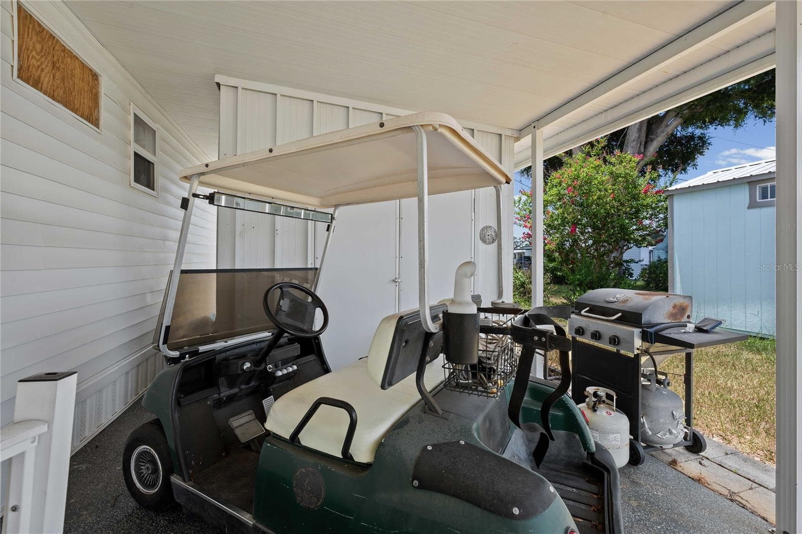 Golf cart is included in the sale of this home! - 5301 FLINT ST, ZEPHYRHILLS