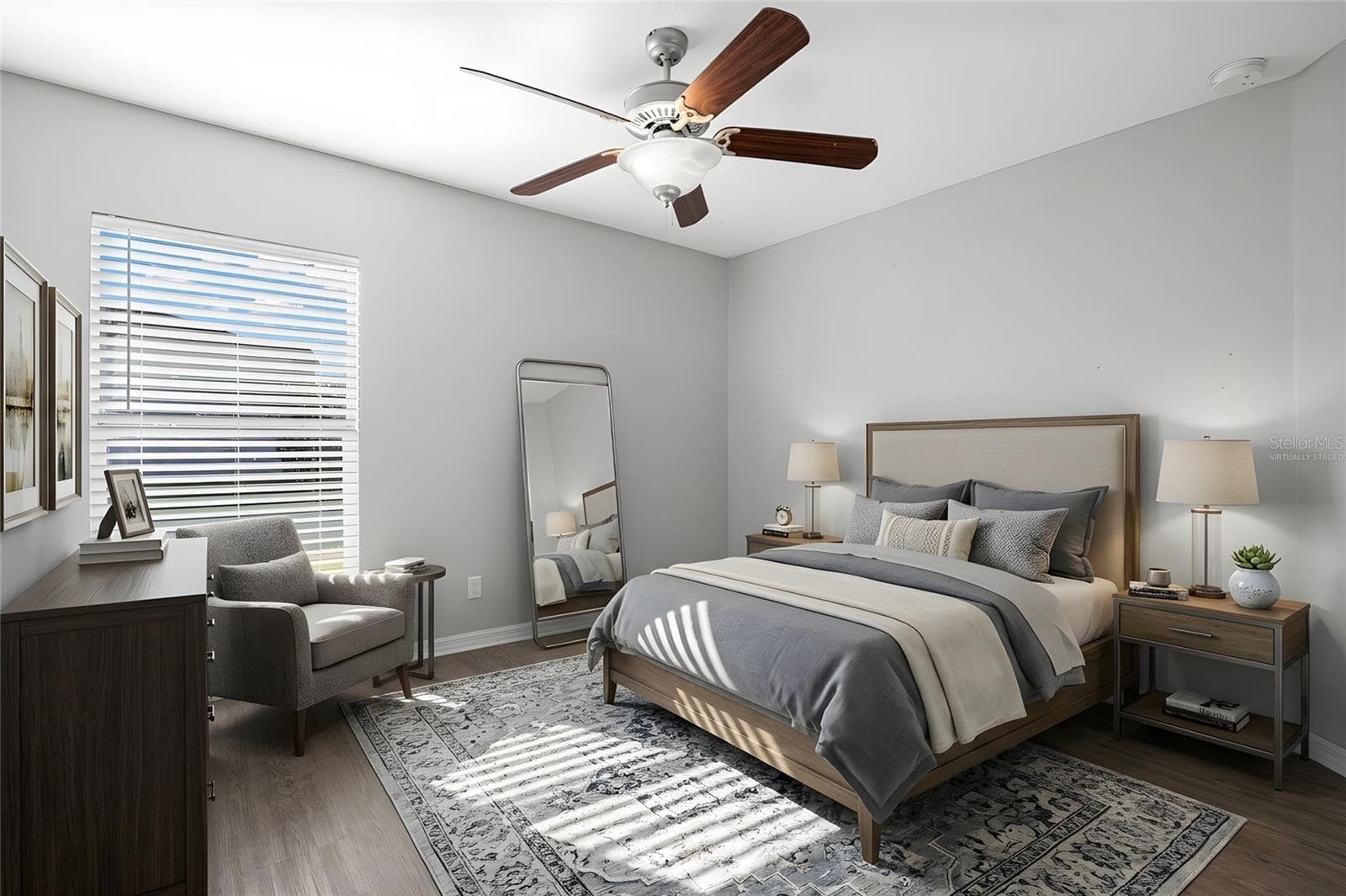 Bedroom 3 features laminate flooring, a ceiling fan, neutral tones, natural light, and a built-in closet. - 6810 TRENT CREEK DR, SUN CITY CENTER