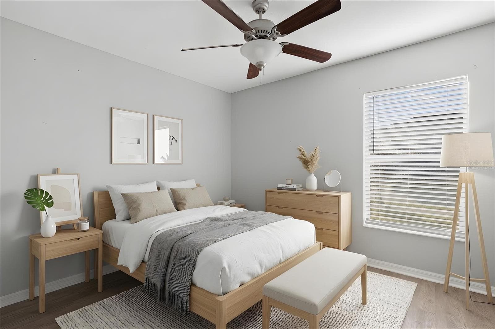 Bedroom 4 features laminate flooring, a ceiling fan, neutral tones, natural light, and a built-in closet. - 6810 TRENT CREEK DR, SUN CITY CENTER