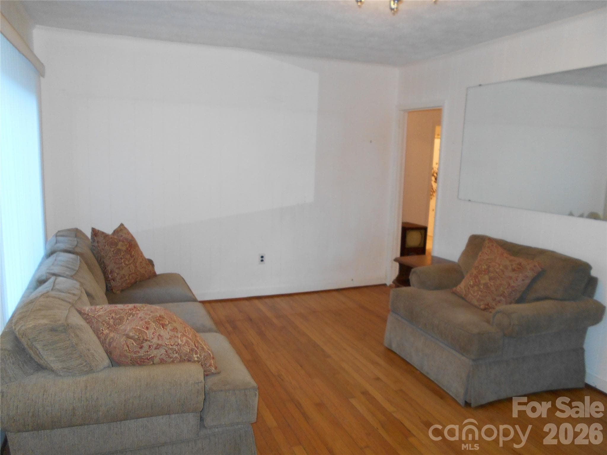 Living room with original hardwood floors - Black Mountain