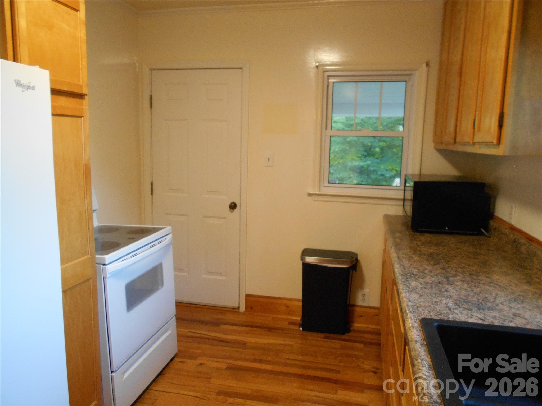 Kitchen. Door opens to a larged covered patio - Black Mountain