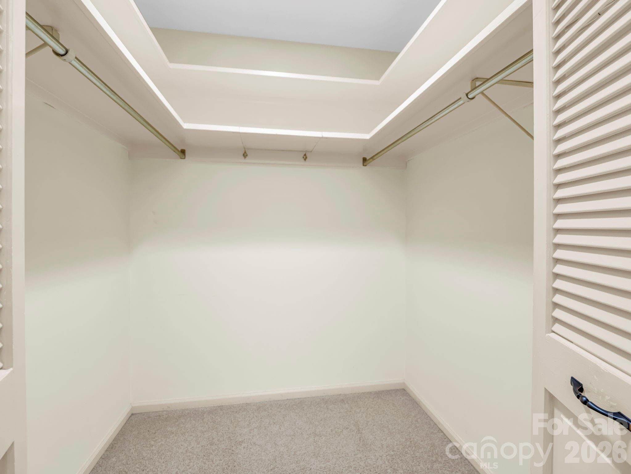 Primary bedroom walk-in closet - 115 Woodhaven Drive, Hendersonville