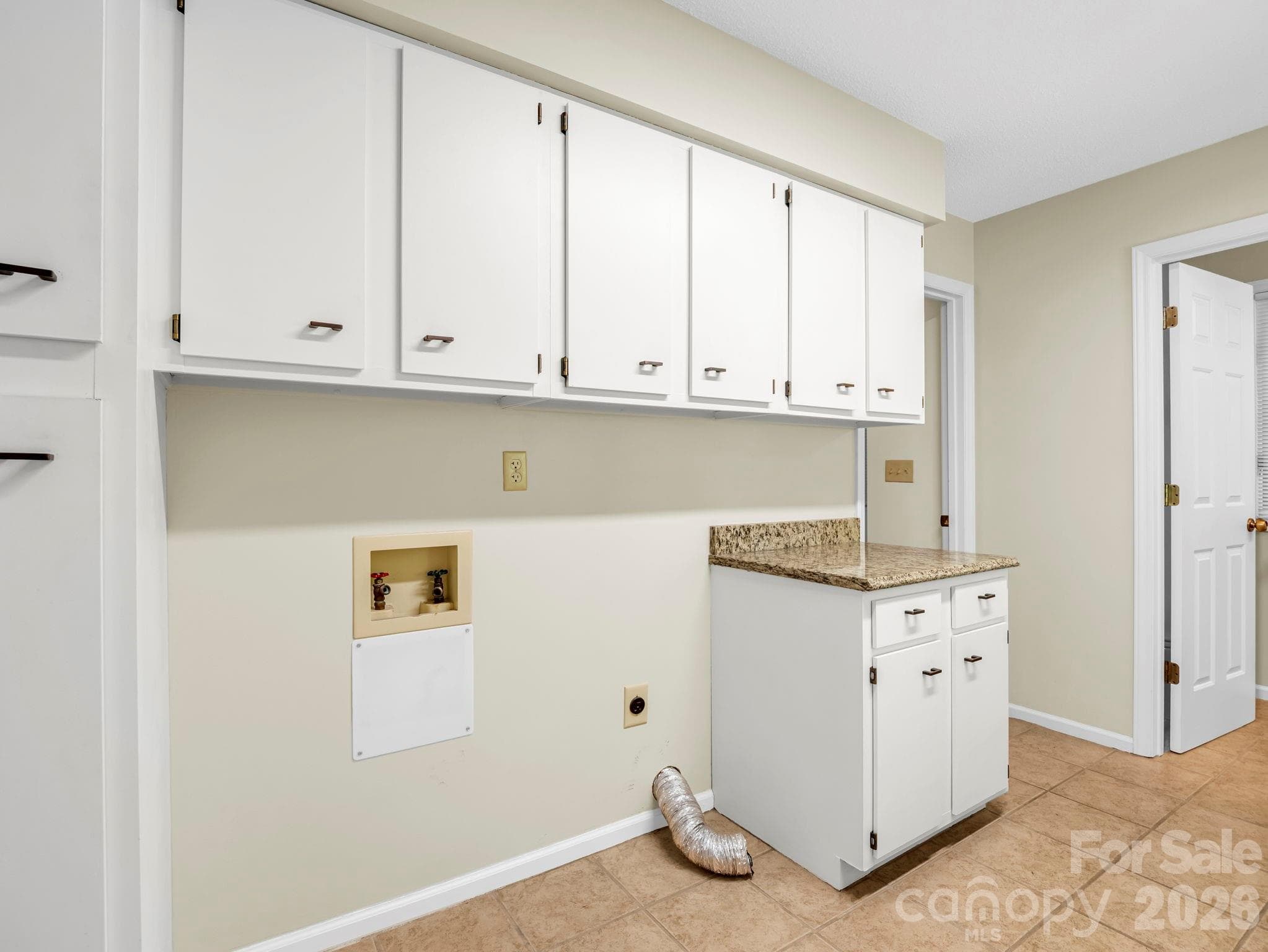 Main Level Laundry & Mud Room off of the Garage & Kitchen - with Half Bath - 115 Woodhaven Drive, Hendersonville