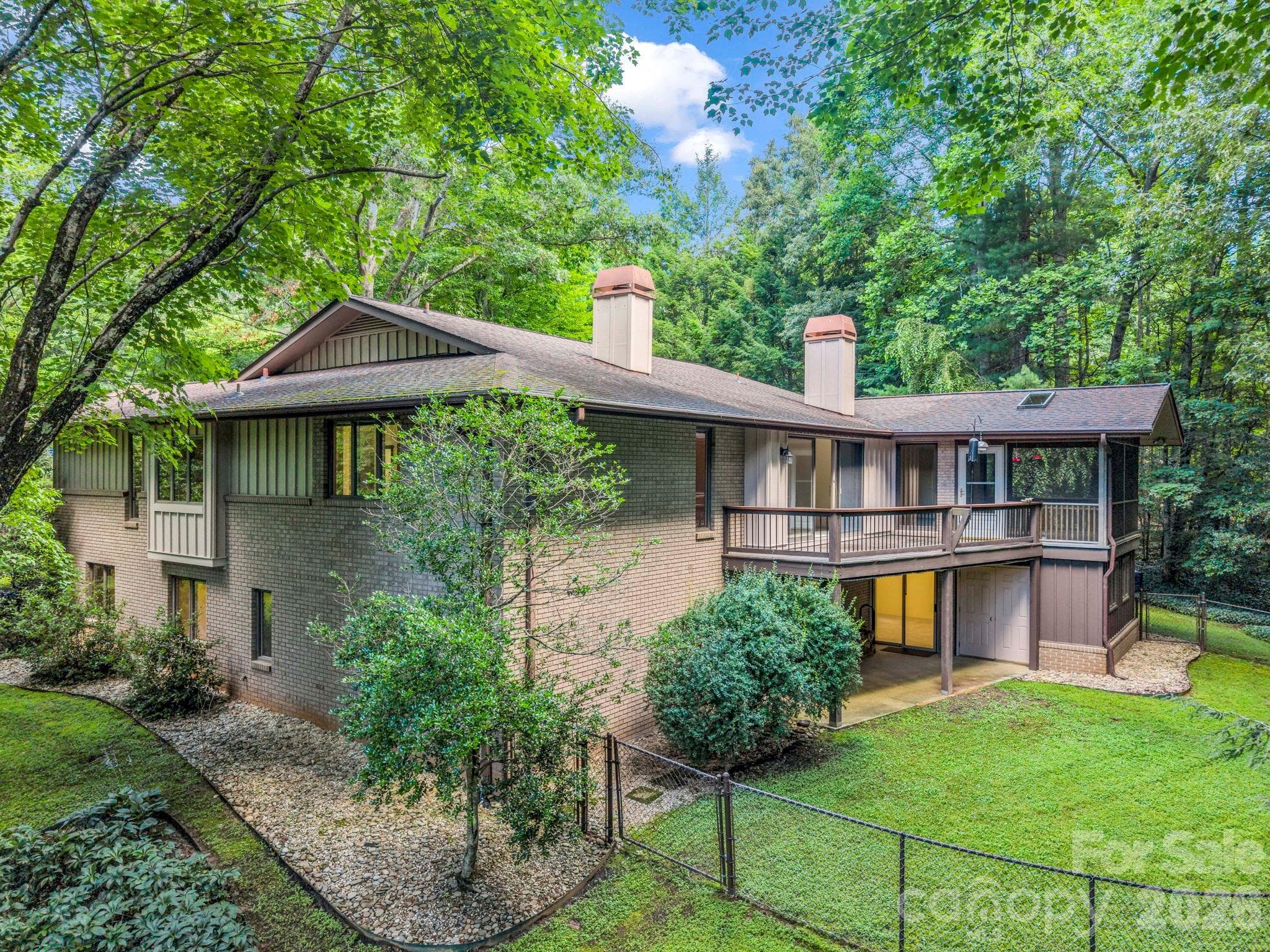 Rear of home, with fenced backyard - 115 Woodhaven Drive, Hendersonville
