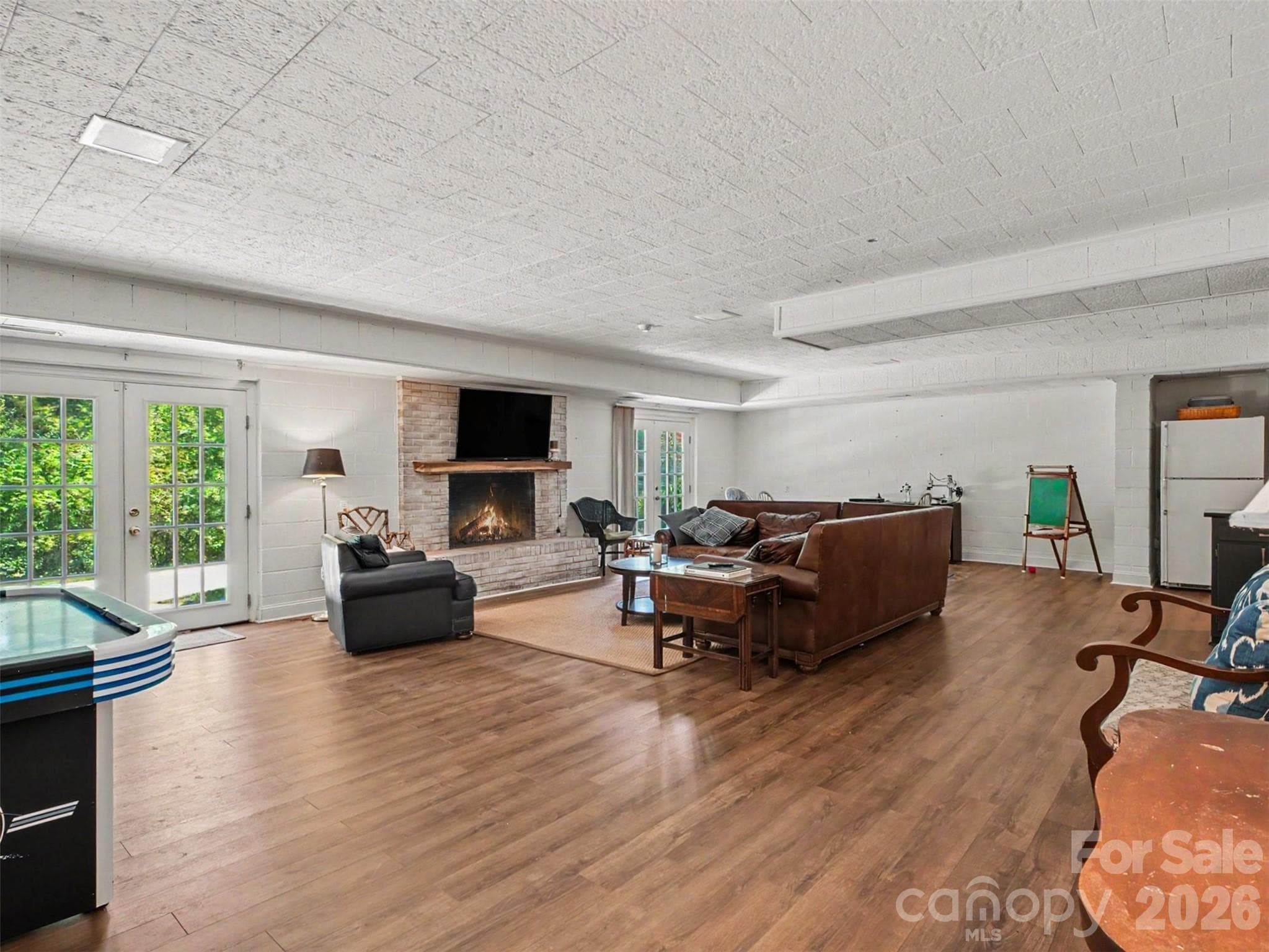 The basement living room: space to spread out and settle in - 441 Claymont Street SE, Concord