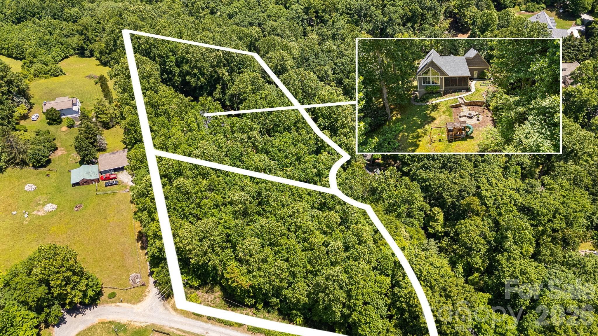 Drone view of lot and neighboring parcel - Hendersonville