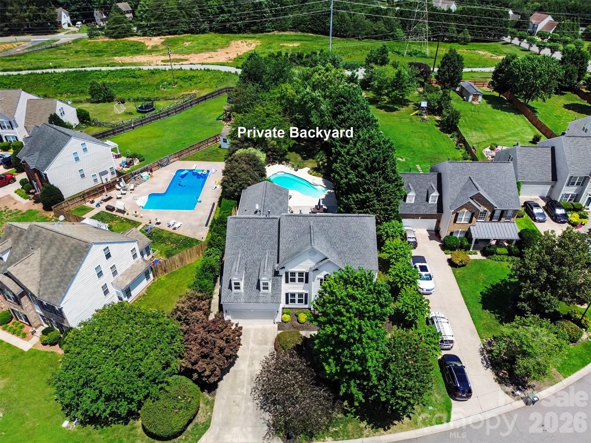 Surrounded by trees and lush landscaping providing privacy in your backyard oasis! - Denver