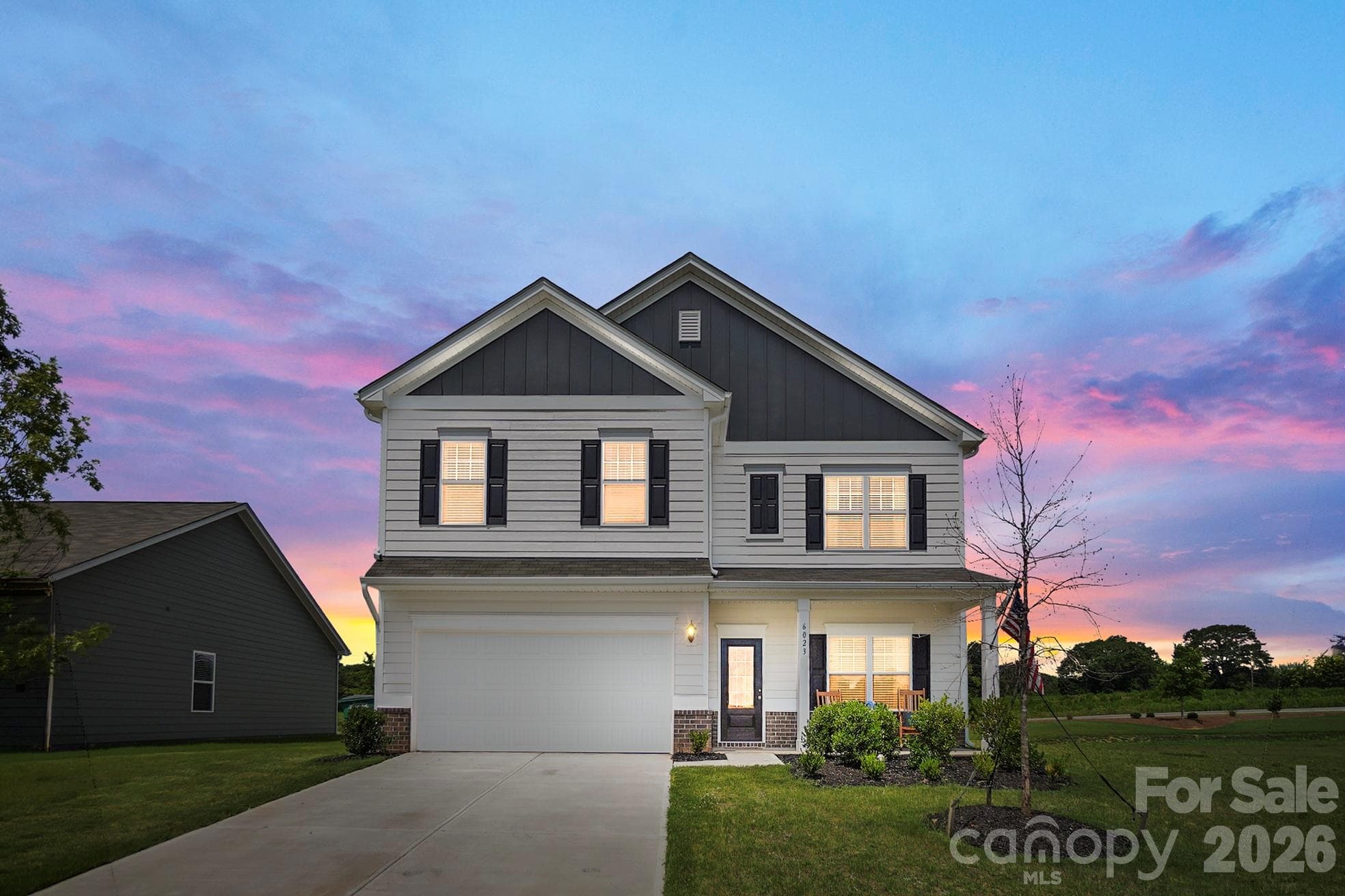 Beautiful evening view highlighting the home’s welcoming exterior. - 6023 Busch Way, Midland
