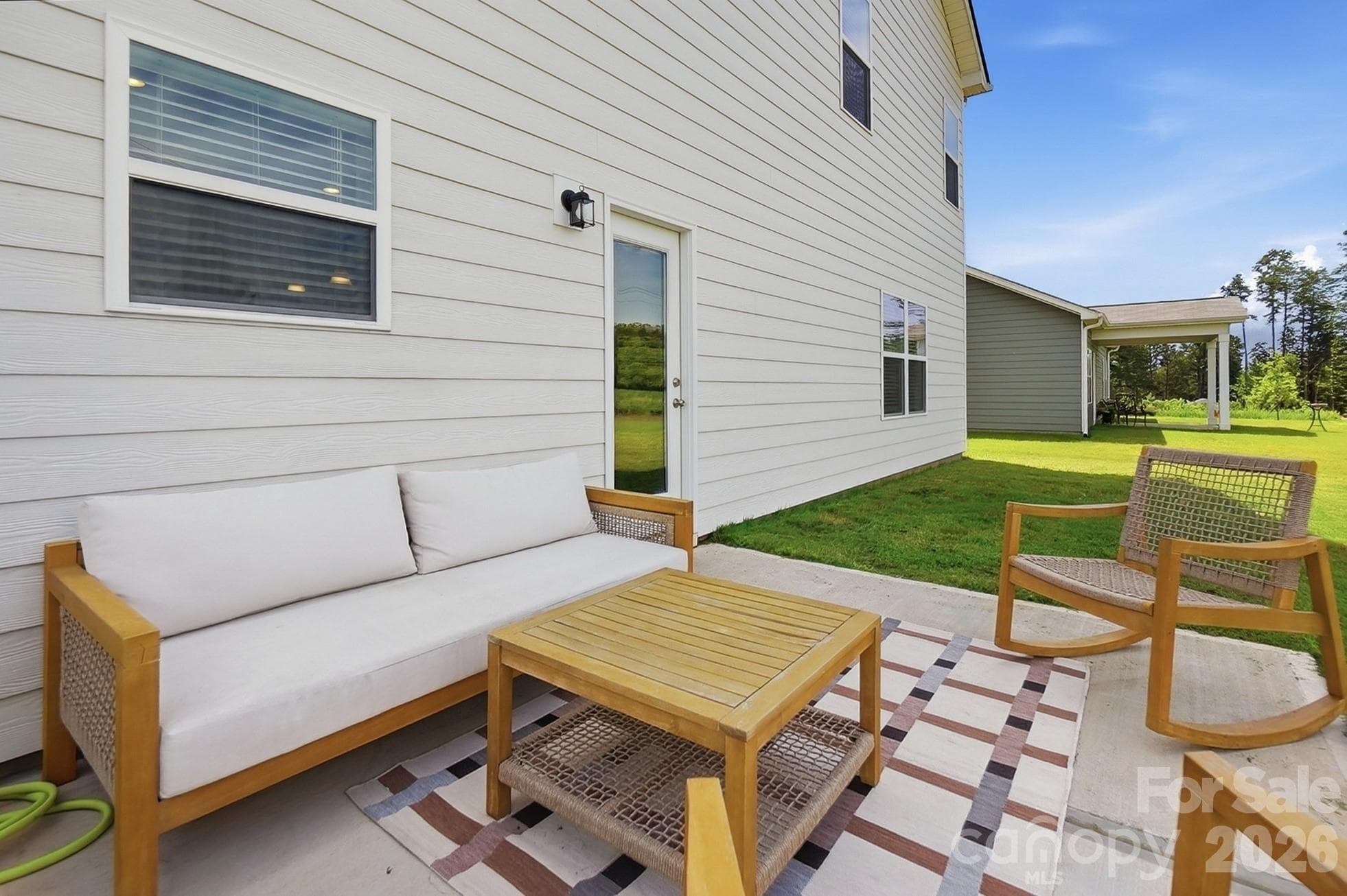 Rear patio offers a great spot for outdoor dining and relaxation. - 6023 Busch Way, Midland