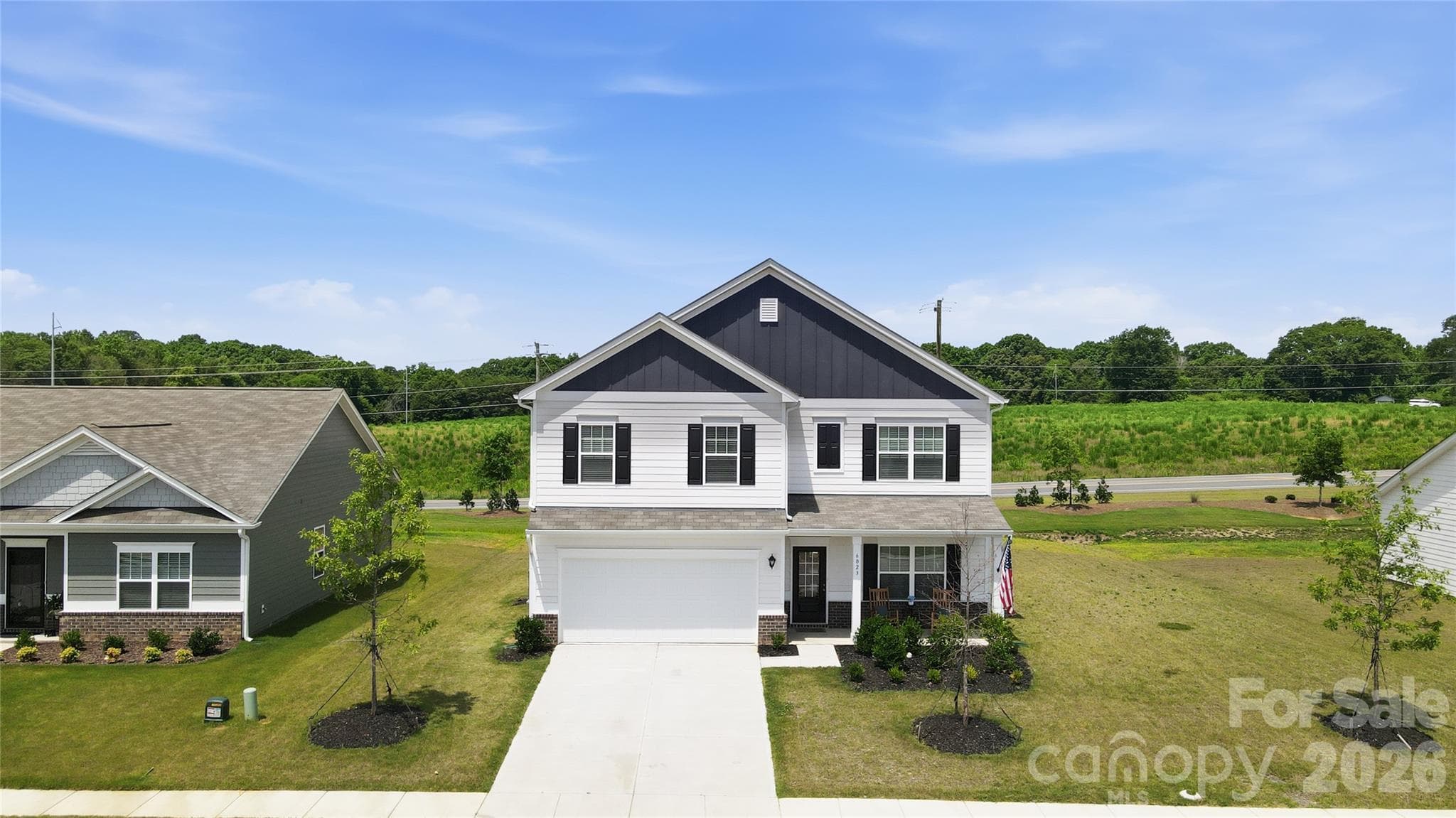 Aerial front view of the home and surrounding neighborhood. - 6023 Busch Way, Midland