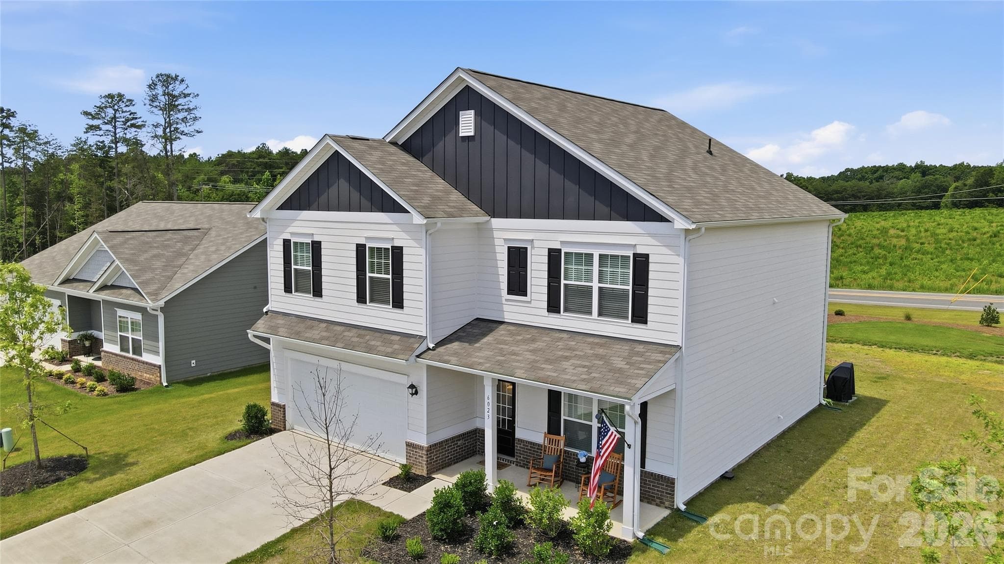 Attractive curb appeal with an attached two-car garage. - 6023 Busch Way, Midland