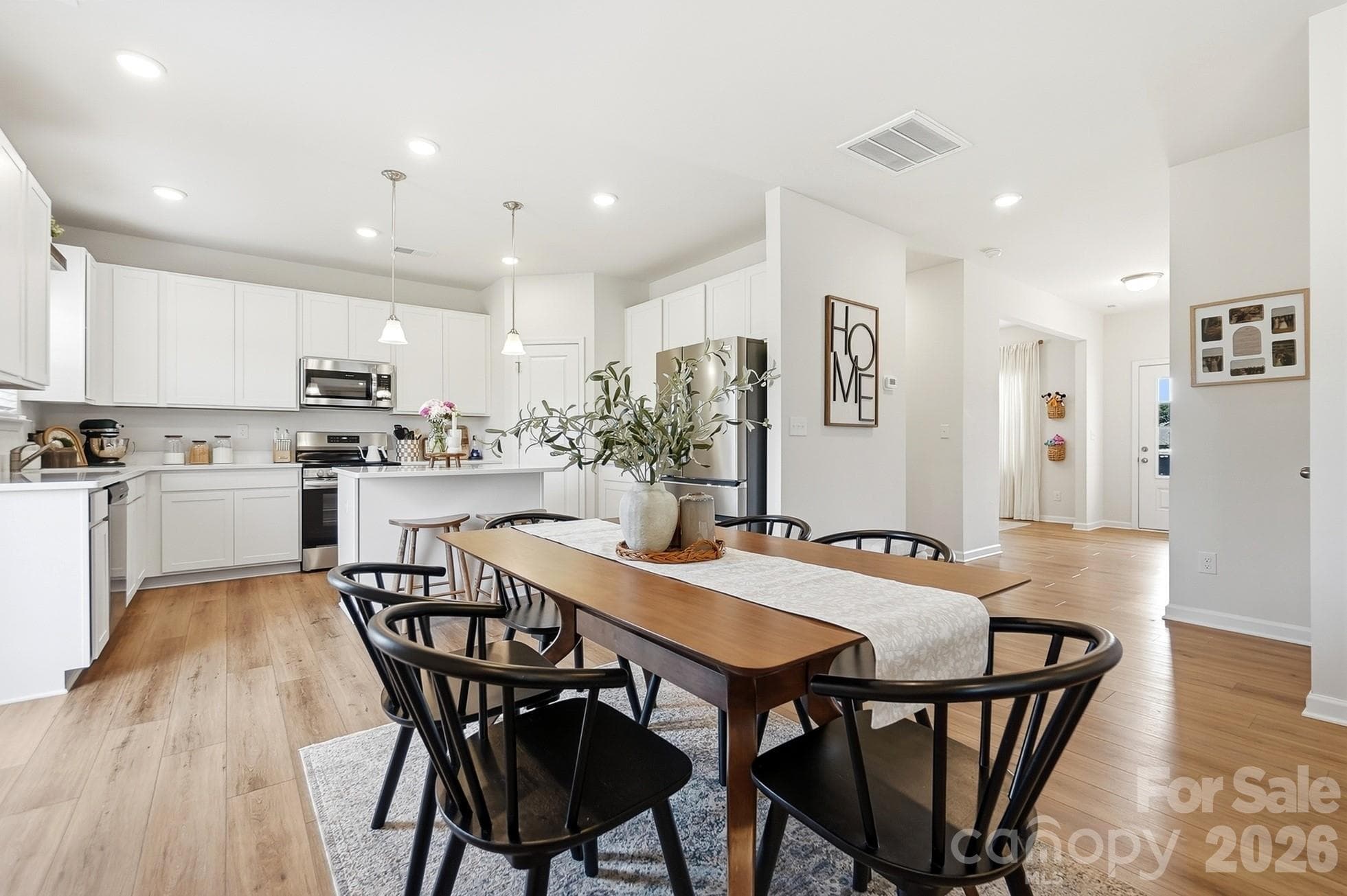 Open dining area with easy access to the kitchen and backyard. - 6023 Busch Way, Midland
