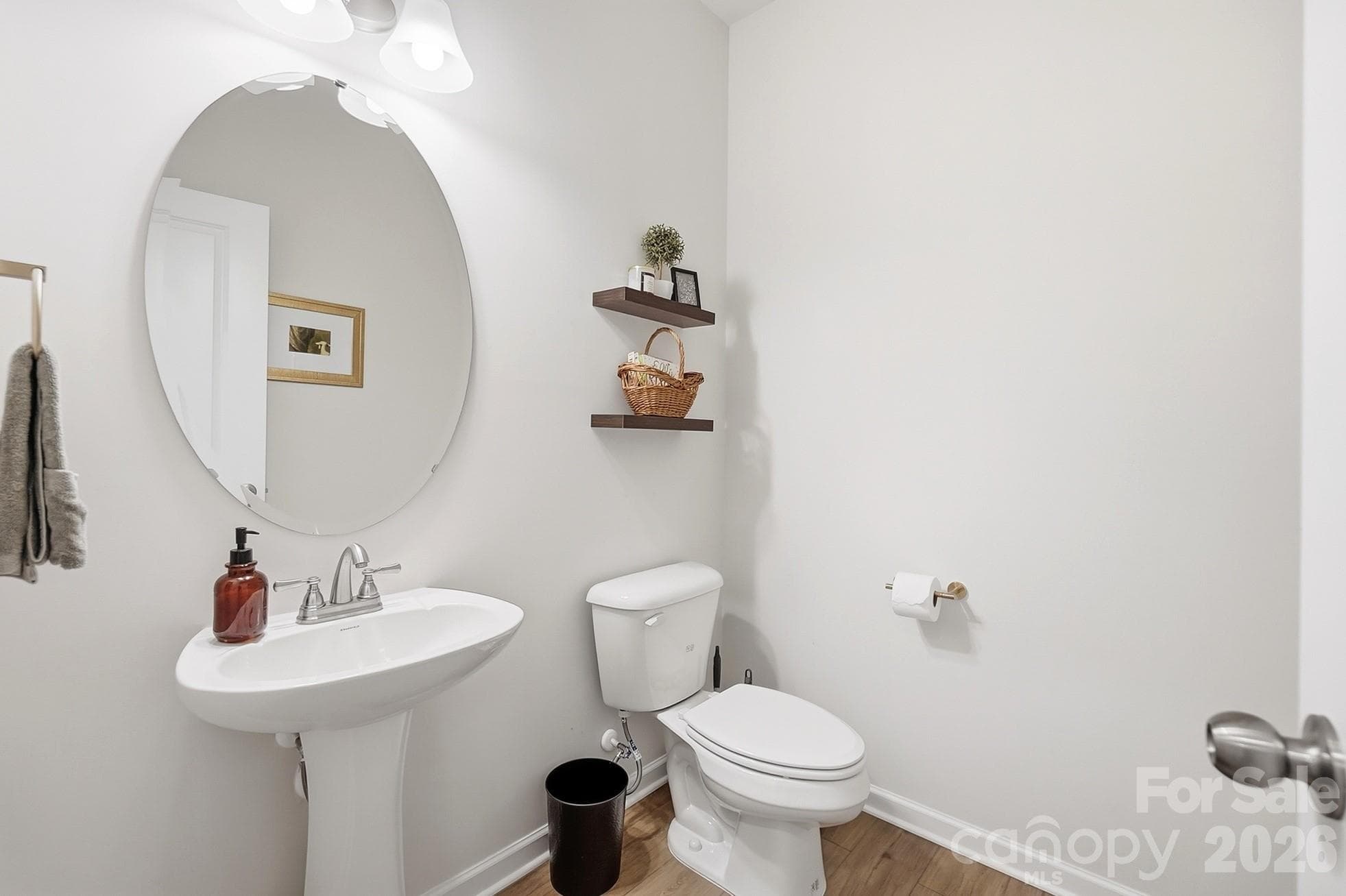 Convenient main-level half bath for guests. - 6023 Busch Way, Midland