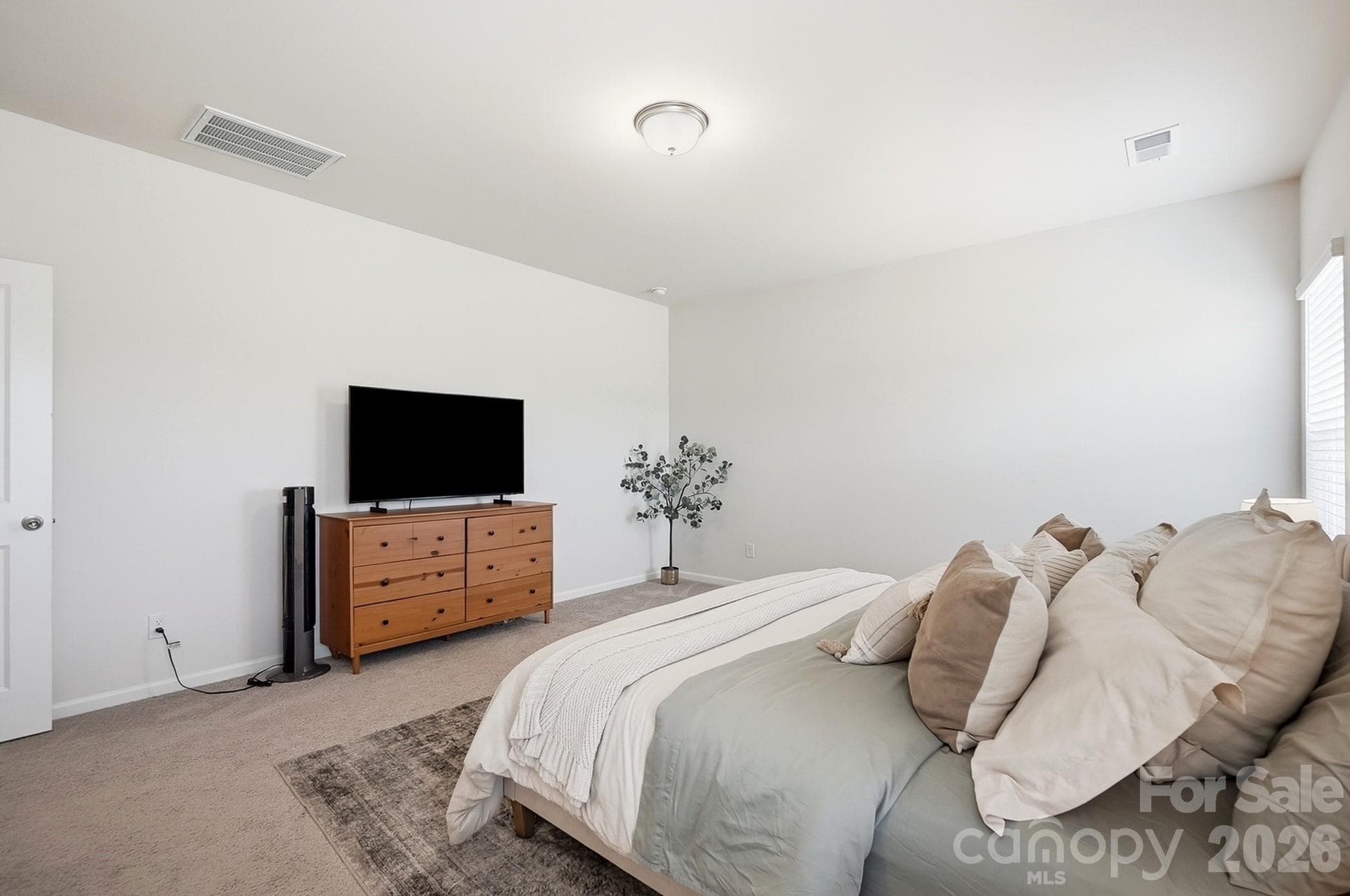 Primary bedroom offers space for both sleeping and sitting areas. - 6023 Busch Way, Midland