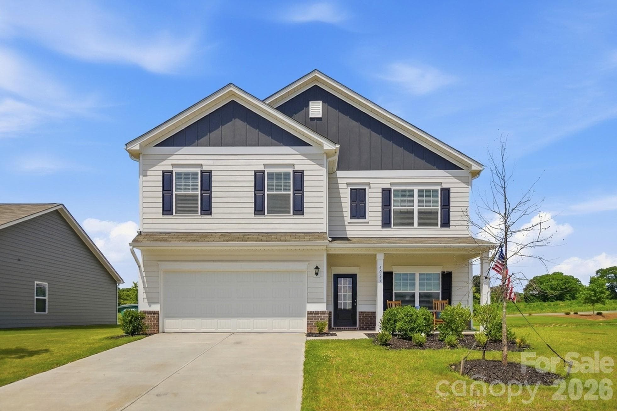 Front exterior view showcasing the home’s classic design. - 6023 Busch Way, Midland