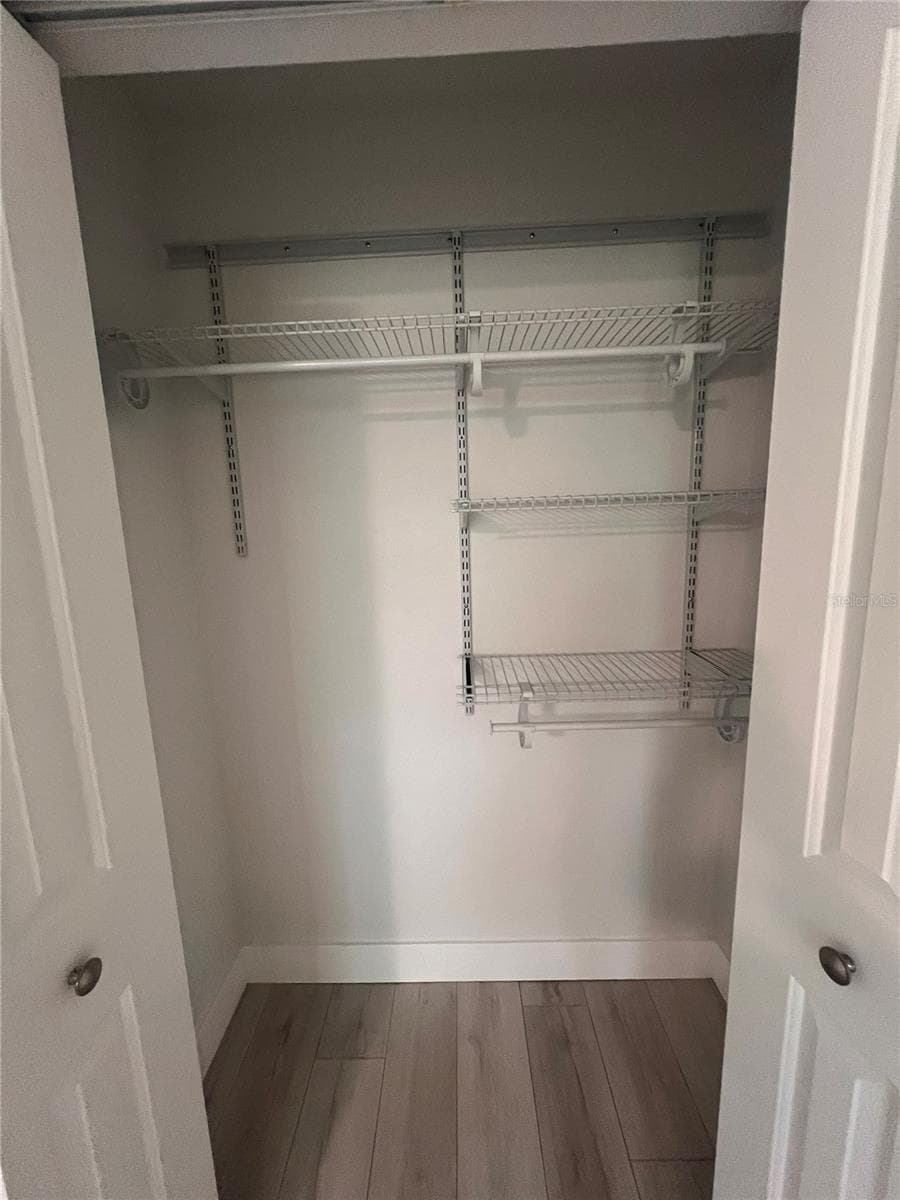 Primary Bedroom Closet - 4044 CORKWOOD CT, PALM HARBOR
