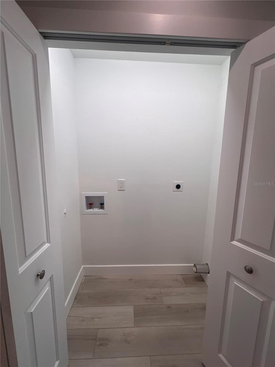 Laundry closet - 4044 CORKWOOD CT, PALM HARBOR