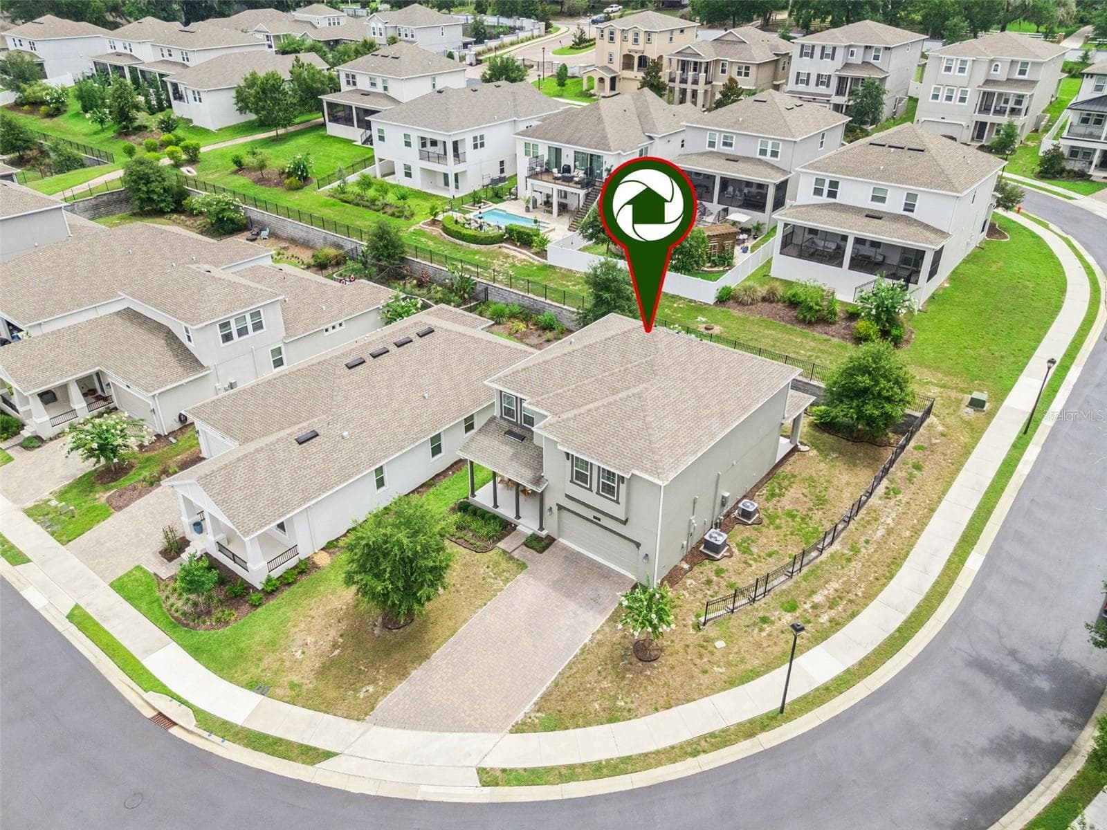 2-car garage with impressive storage flexibility & paver driveway - 1235 DORA PARC LN, MOUNT DORA