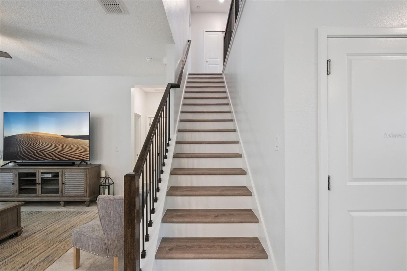 Garage entry next to stairs into foyer area - 1235 DORA PARC LN, MOUNT DORA