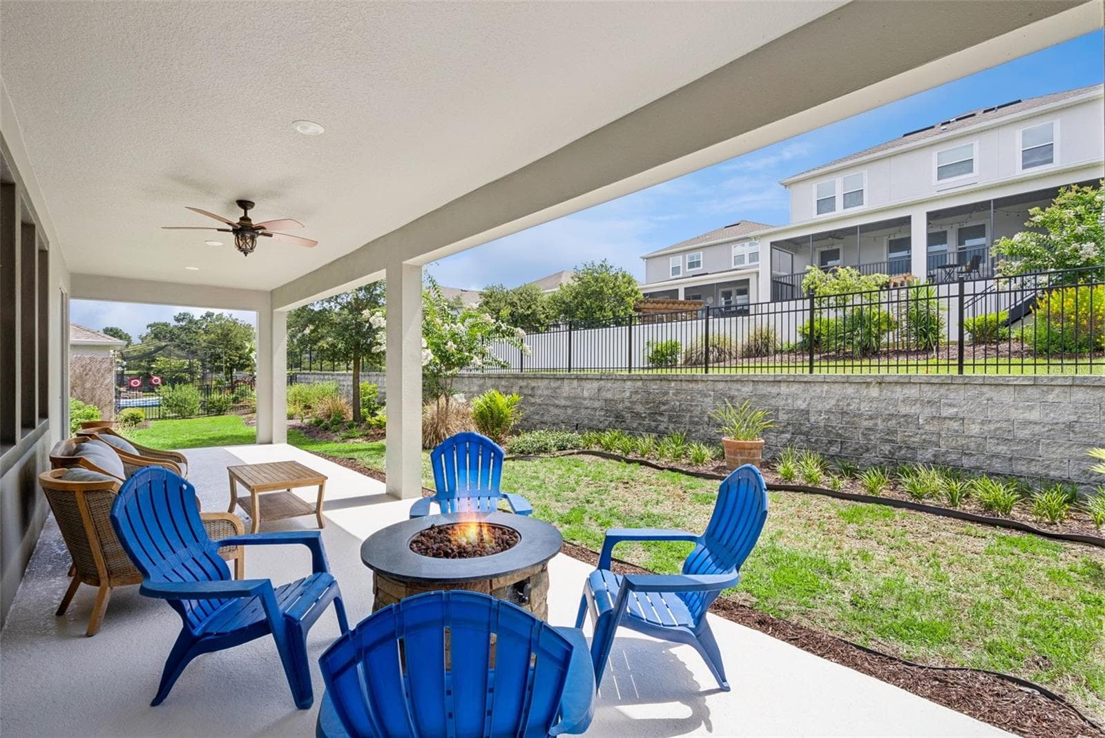 Covered rear porch with room to gather - 1235 DORA PARC LN, MOUNT DORA