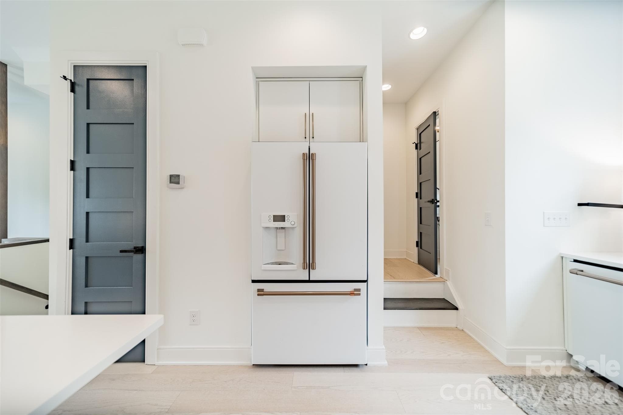 Powder Room and Stairway to the Upper Level off the Kitchen - Charlotte