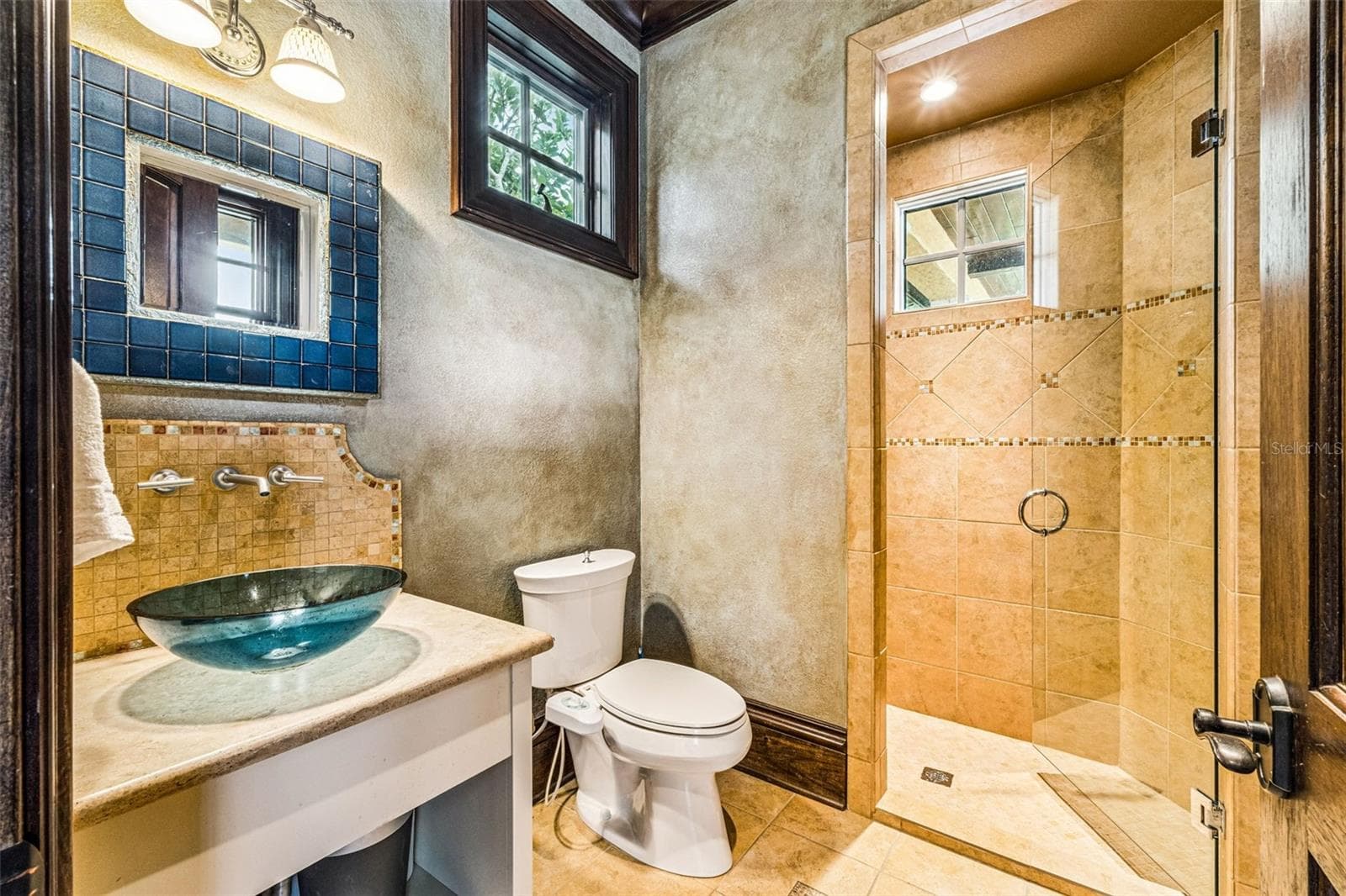 Bathroom with easy access to pool area. - 16619 AREZO CT, MONTVERDE