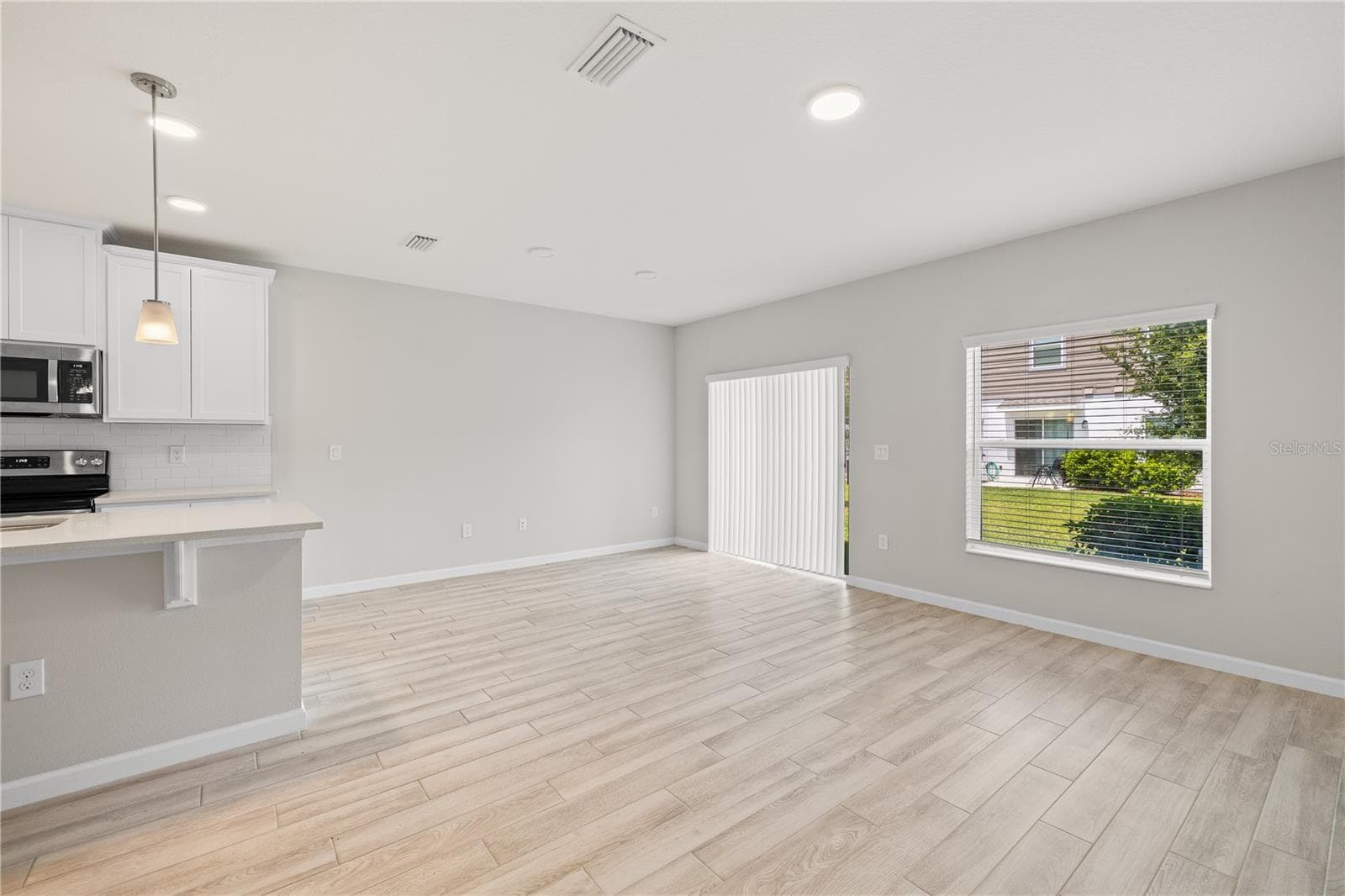 Living Room and Dining Room - 14856 HARVEST ST, ORLANDO