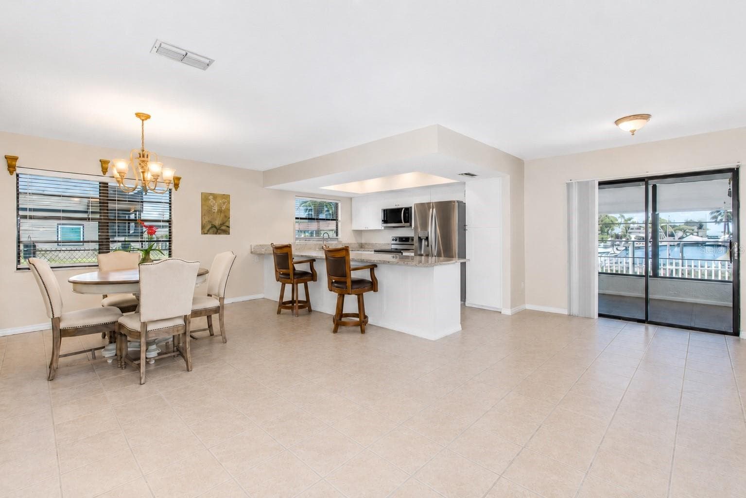Dining and kitchen. - 13525 CLAUDIA DR, HUDSON