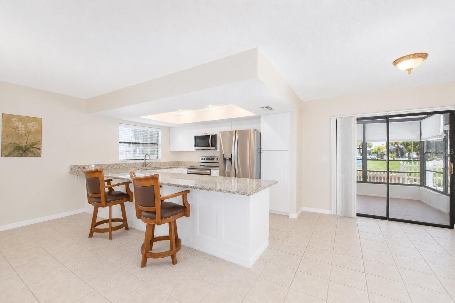 Dining and kitchen. - 13525 CLAUDIA DR, HUDSON