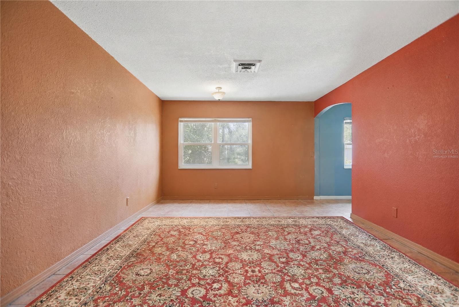 Living room virtually staged - 120 VALENCIA RD, ROCKLEDGE
