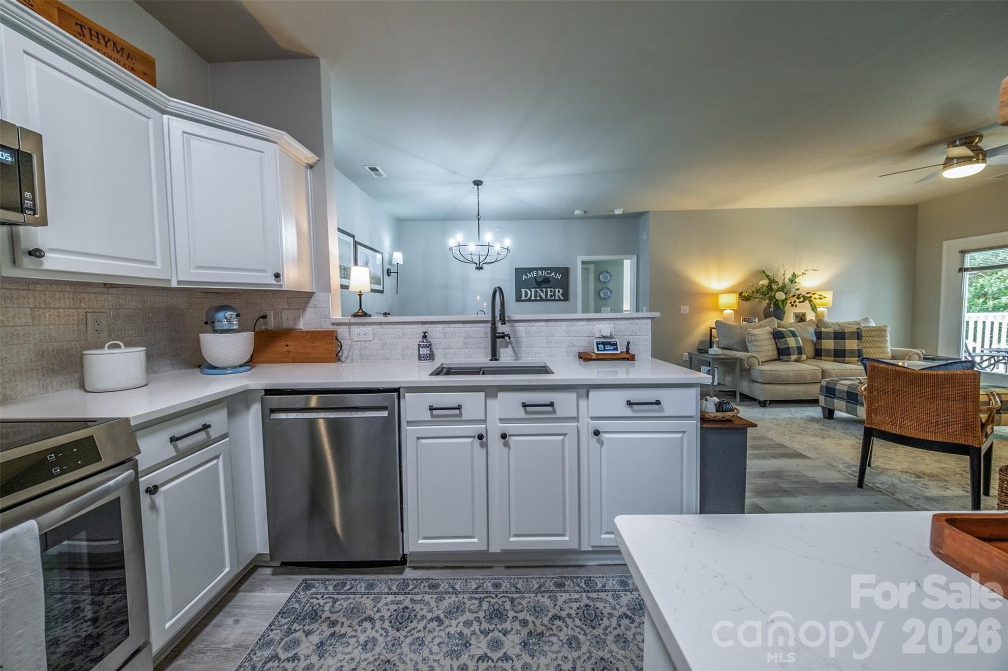 Kitchen looking onto living & dining rooms - Charlotte
