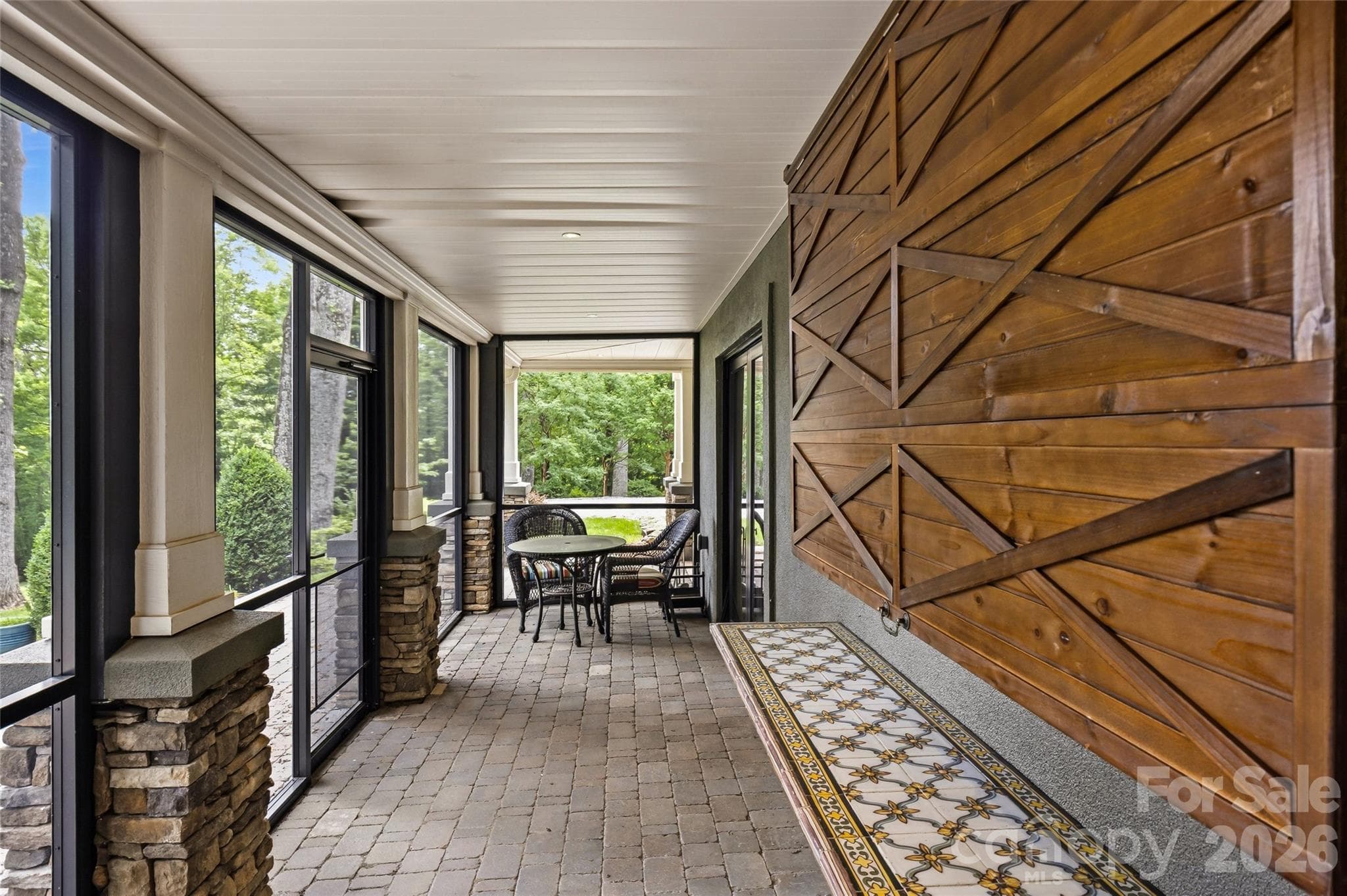 Back screened porch on lower level. - 233 Tanglewood Lane, Saluda