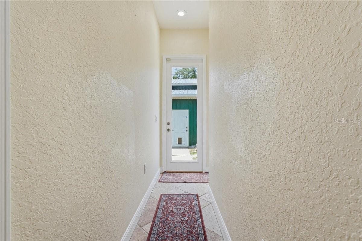 Hallway leading to Green Barn - 7014 JONES RD, ODESSA