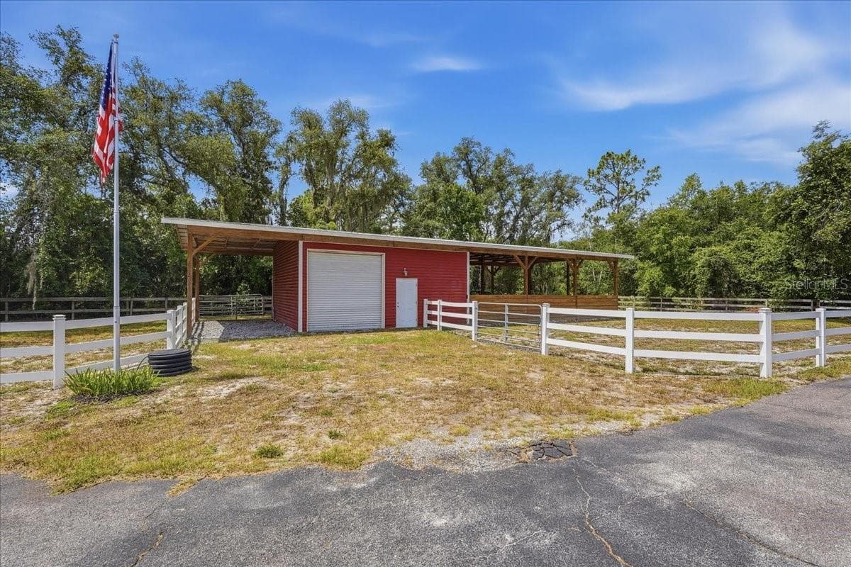 Barn with tack room and 3 stalls. Extra carport area - 7014 JONES RD, ODESSA