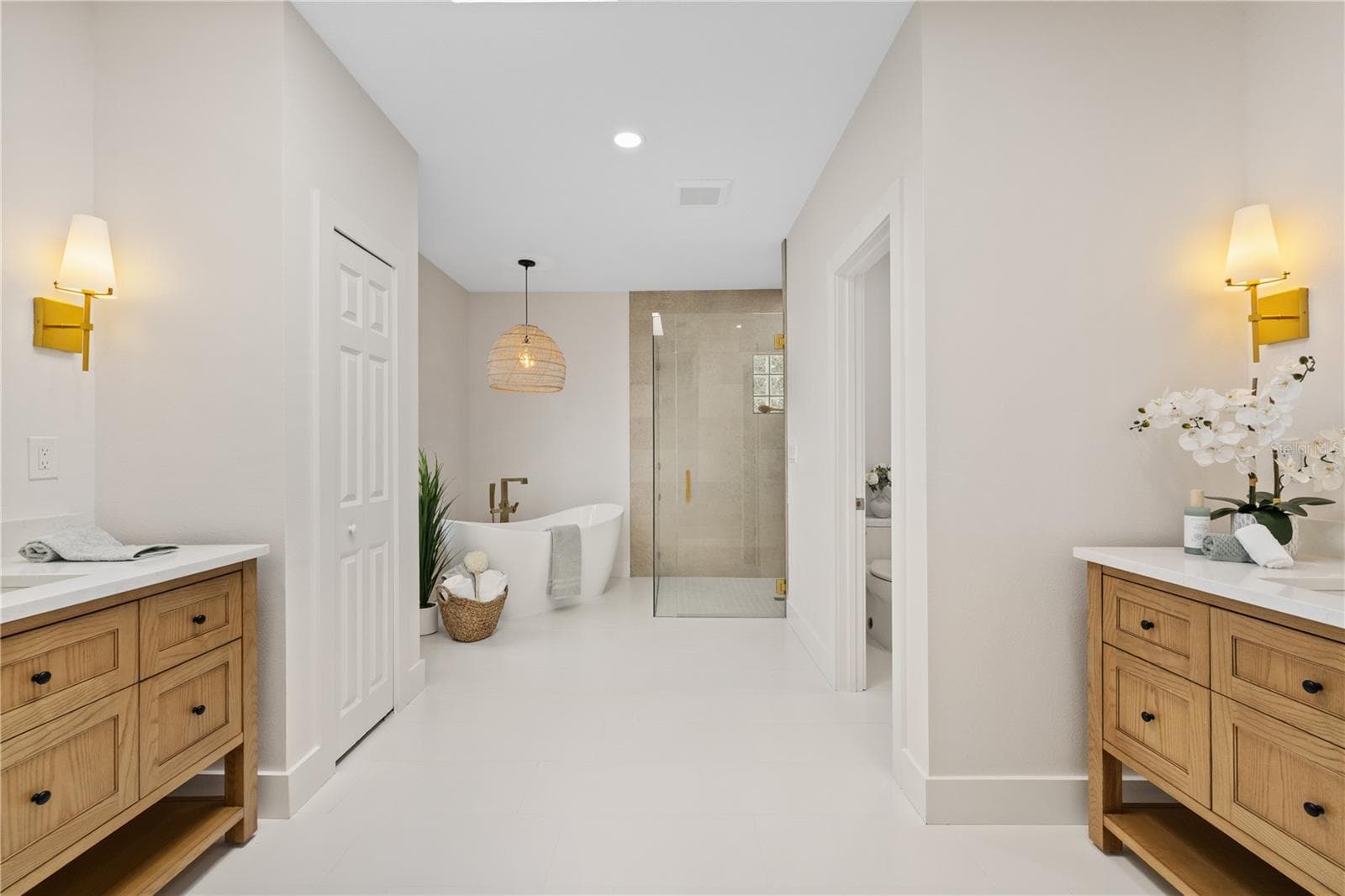 Primary ensuite bathroom with two individual vanity sinks. - 5623 HULL CT, NEW PORT RICHEY