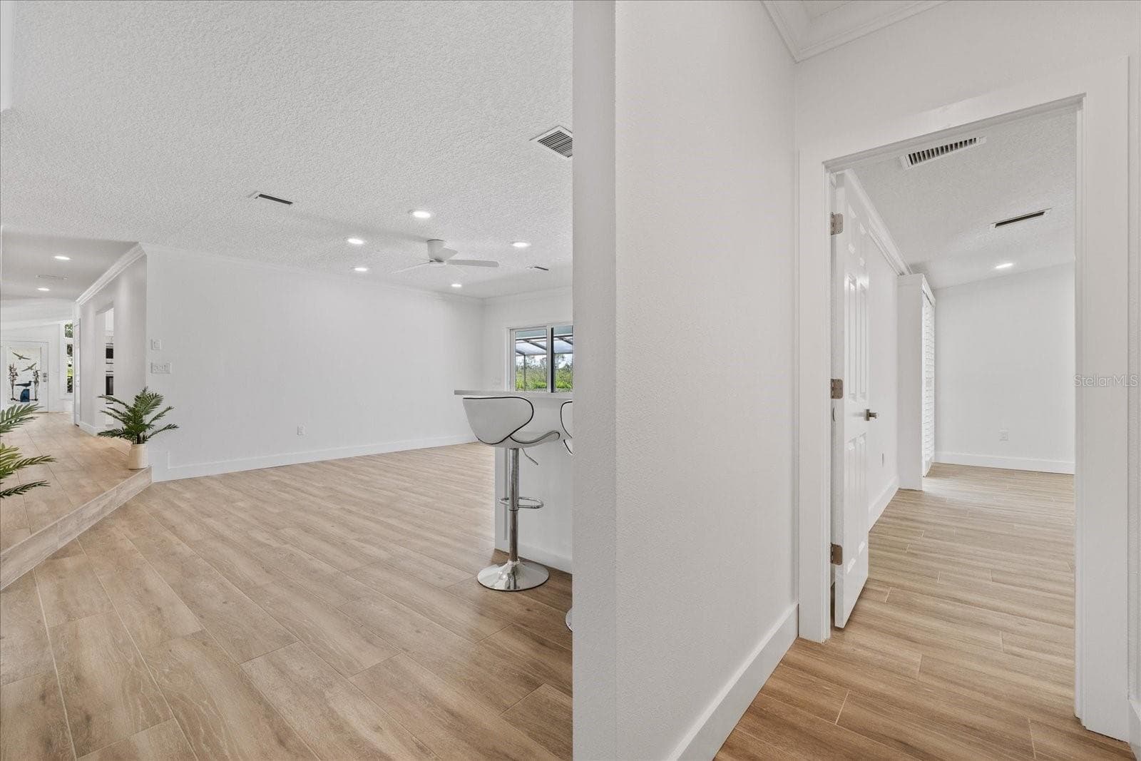 View from Office/Primary hallway toward family room - 5623 HULL CT, NEW PORT RICHEY