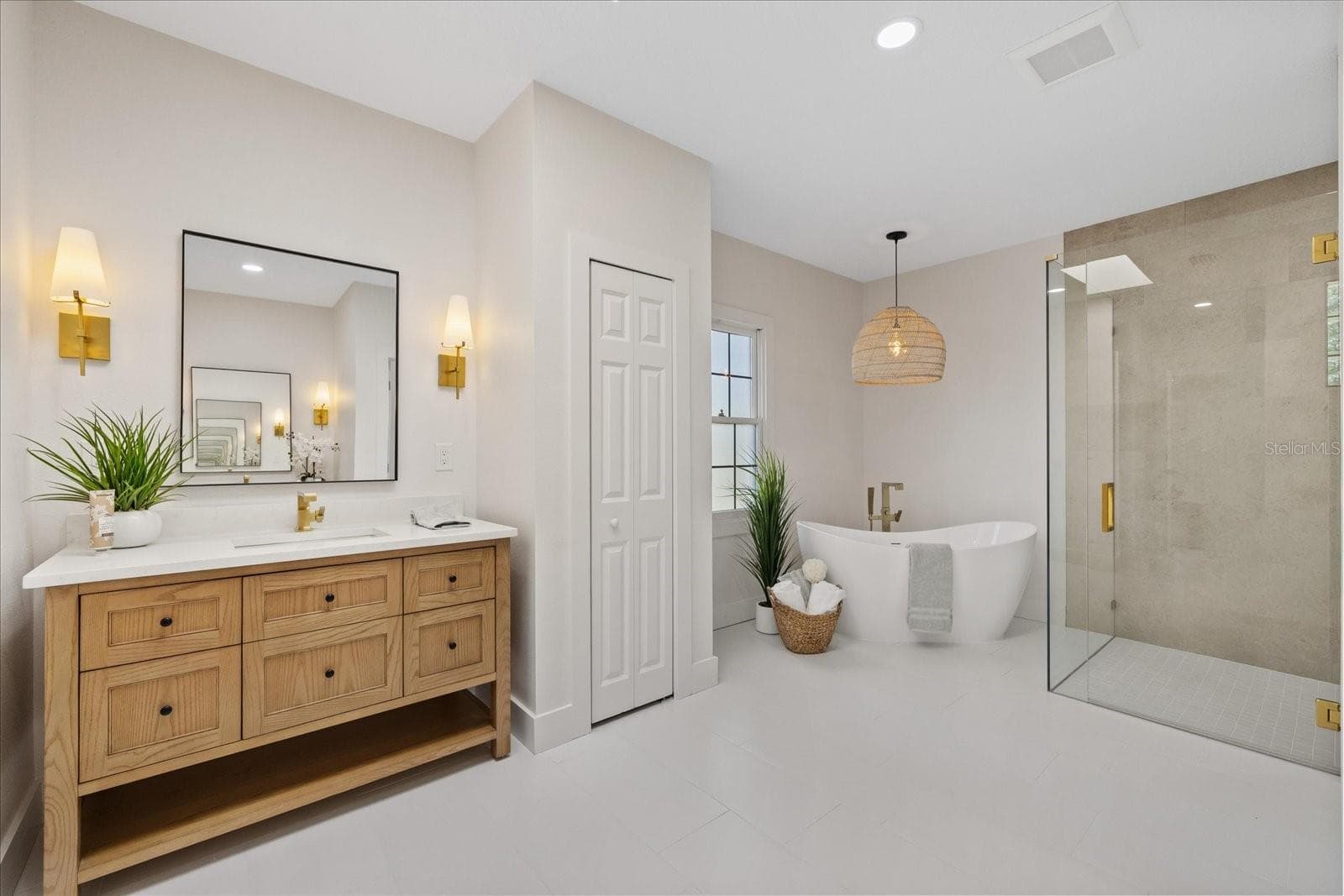 Primary en-suite bath with luxury tub and grand shower. - 5623 HULL CT, NEW PORT RICHEY
