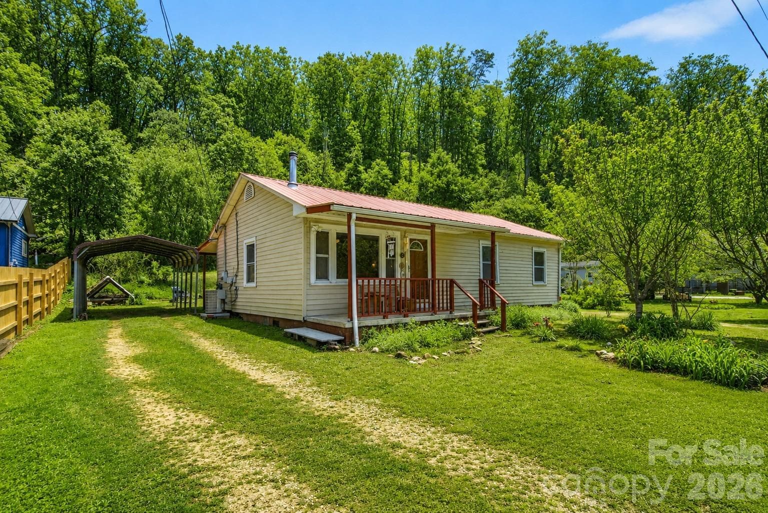 Main floor living, carport, level and just outside Old Fort city limits. - Old Fort