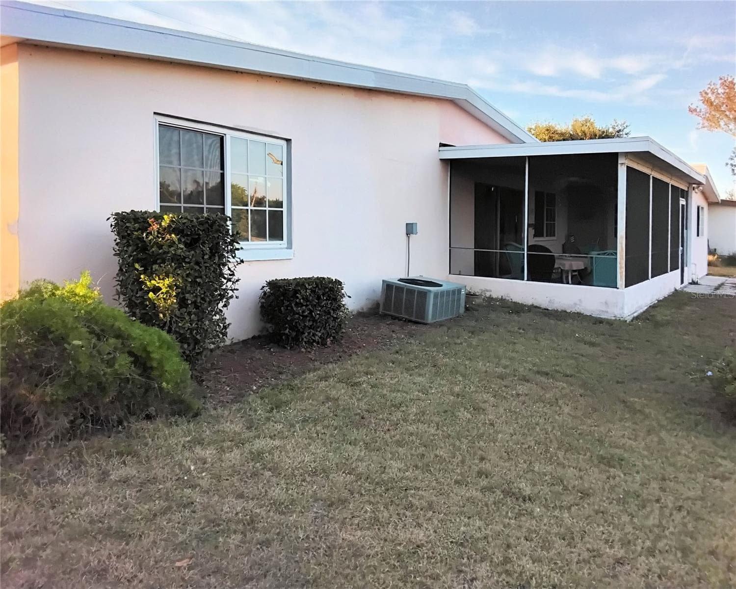 Back of house from left side of backyard - 2440 ELKCAM BLVD, PORT CHARLOTTE