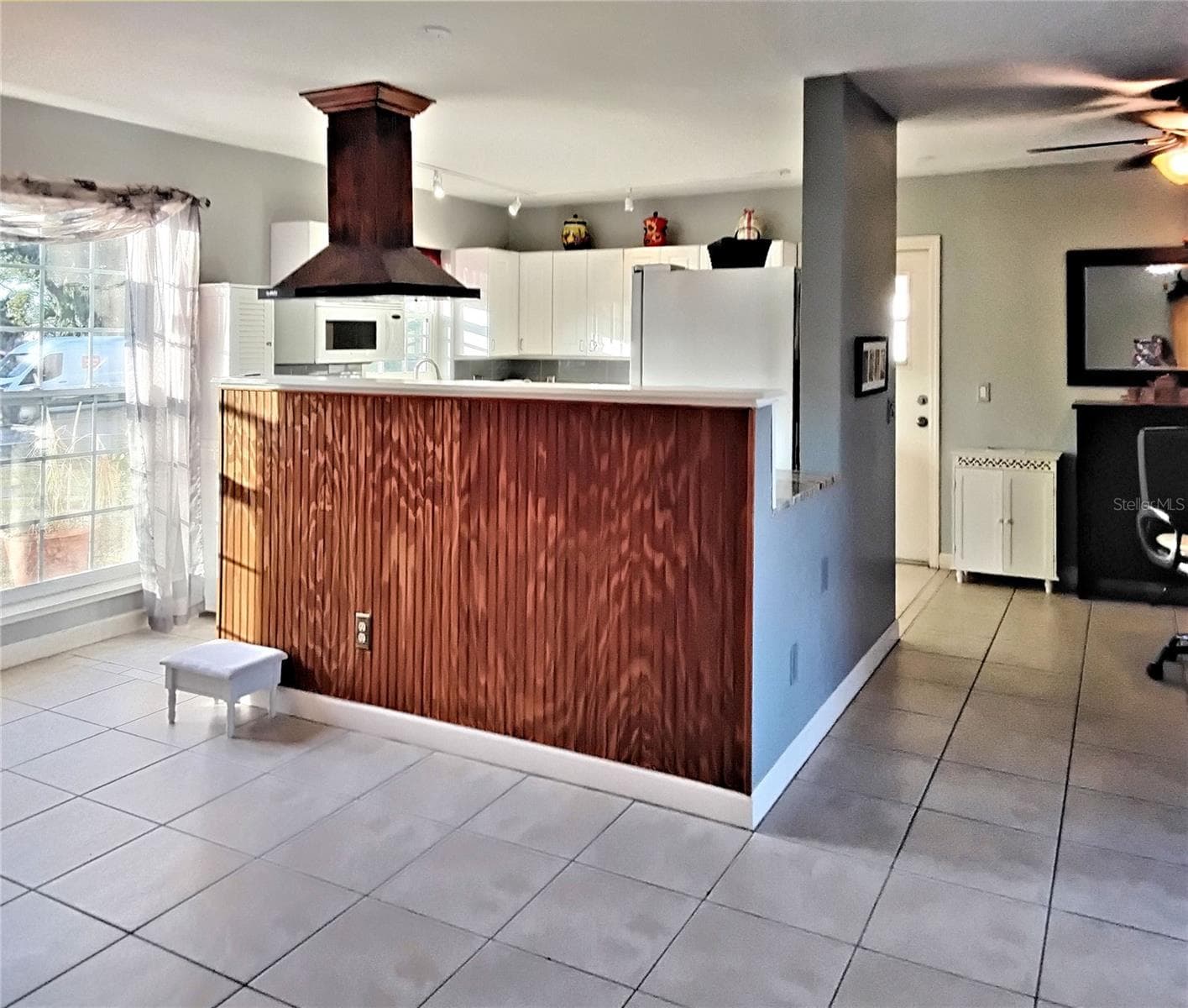 View of living area and kitchen from dining area - 2440 ELKCAM BLVD, PORT CHARLOTTE