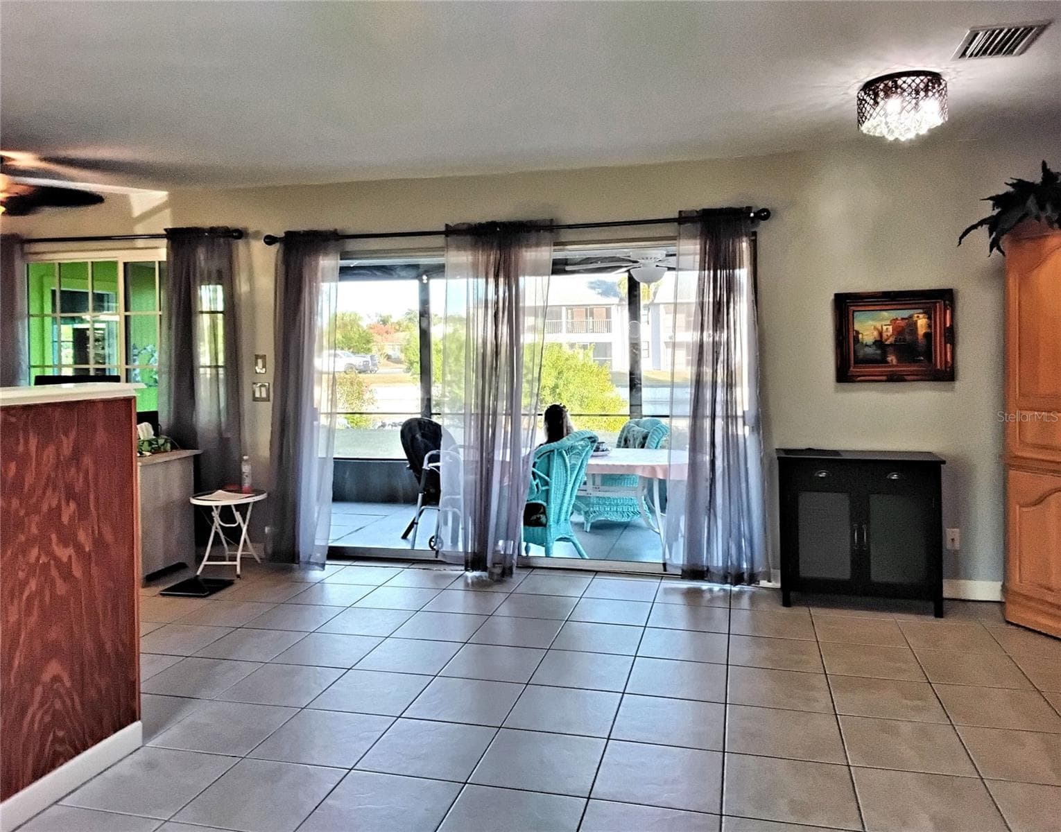 Lanai from entryway - 2440 ELKCAM BLVD, PORT CHARLOTTE