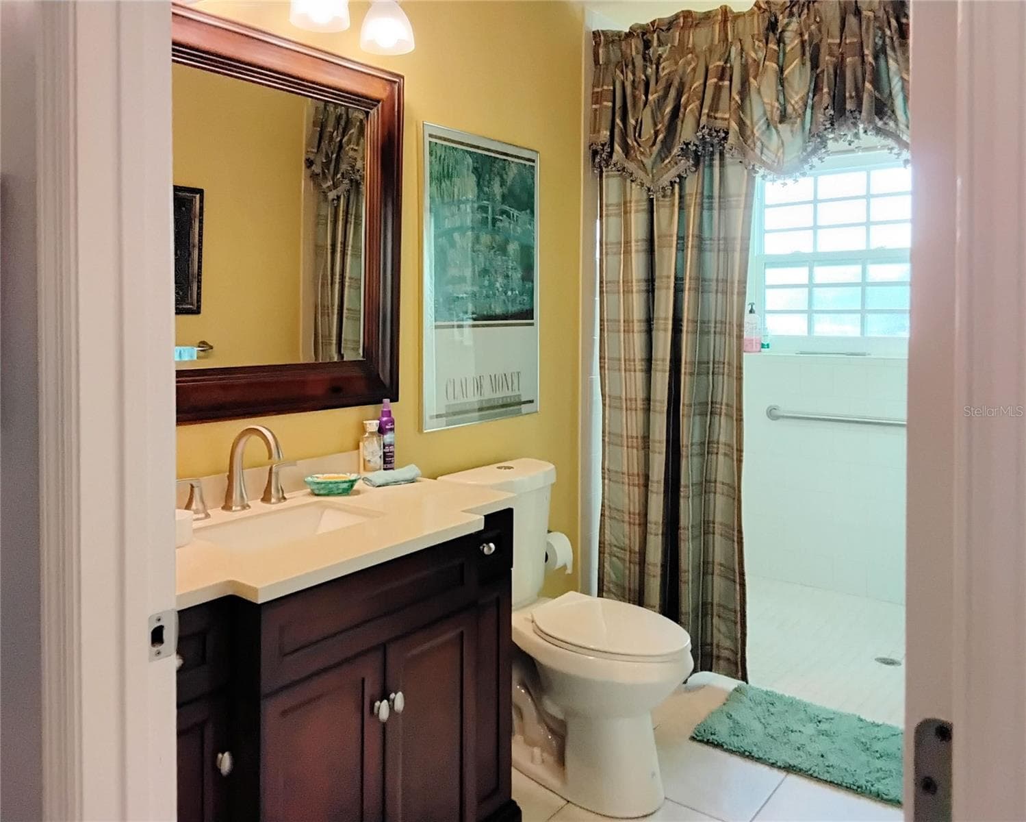 Wheel chair accessible shower in main bath - 2440 ELKCAM BLVD, PORT CHARLOTTE