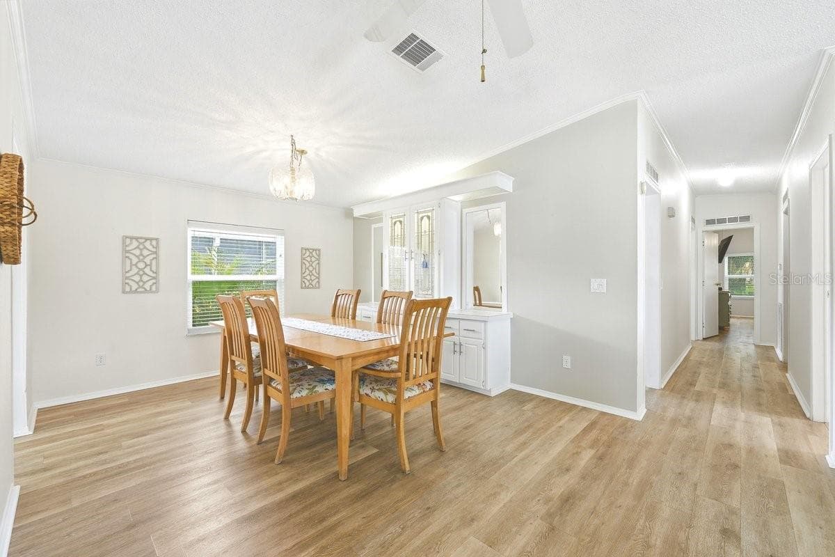 Dining Room with built in lighted cabinet - 304 PORTSIDE LN, EDGEWATER