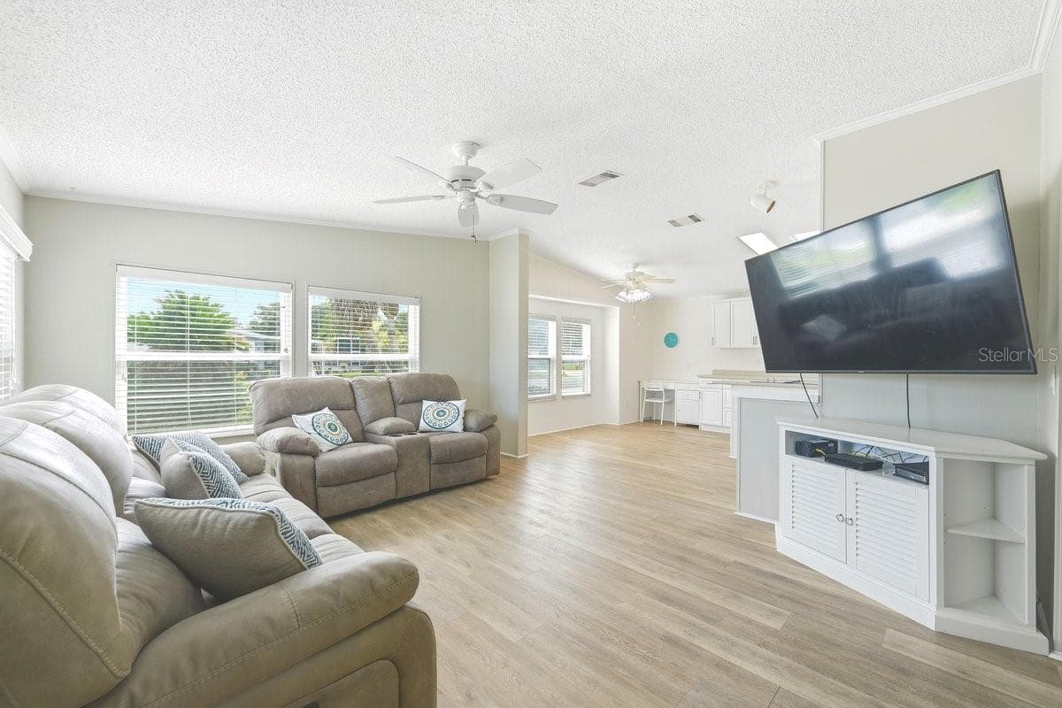 Family Room off the kitchen. Notice the Luxury Vinyl Flooring throughout the home - 304 PORTSIDE LN, EDGEWATER