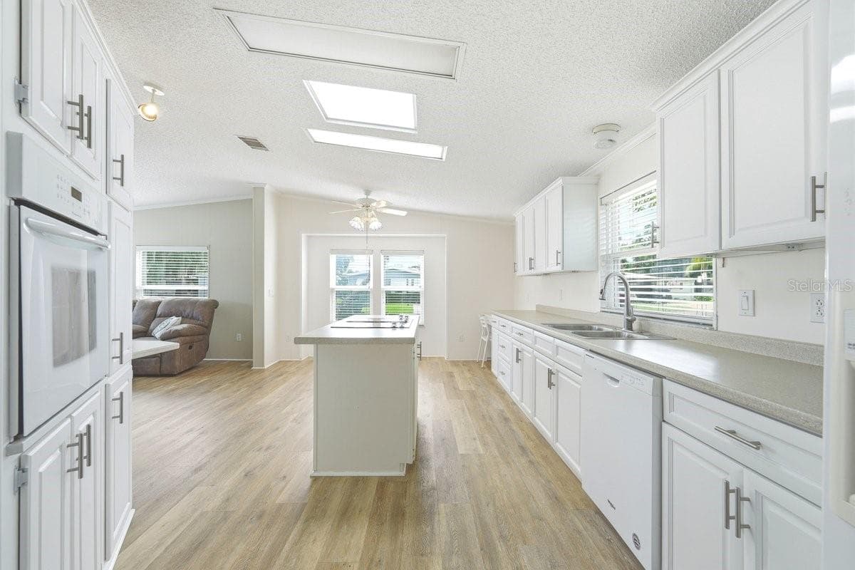 View of kitchen from Dining Room - 304 PORTSIDE LN, EDGEWATER