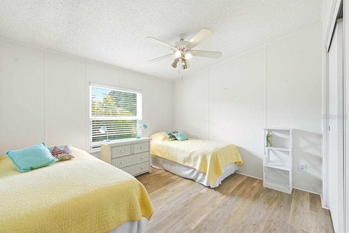 Bedroom 2 with large closet, ceiling fan - 304 PORTSIDE LN, EDGEWATER