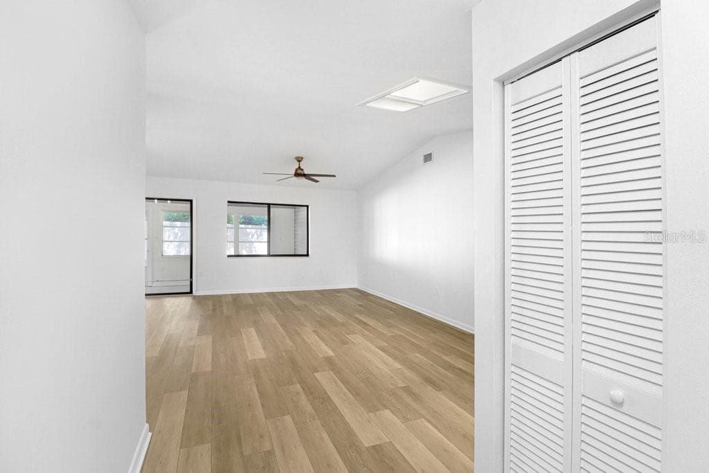 From Front Door & Foyer step into Living/Dining Rm.  To Right, coat closet, hall to bedrooms adjoining bathrooms and hall closet. - 4949 PLEASANT HOLLOW TRL #211, LAKELAND